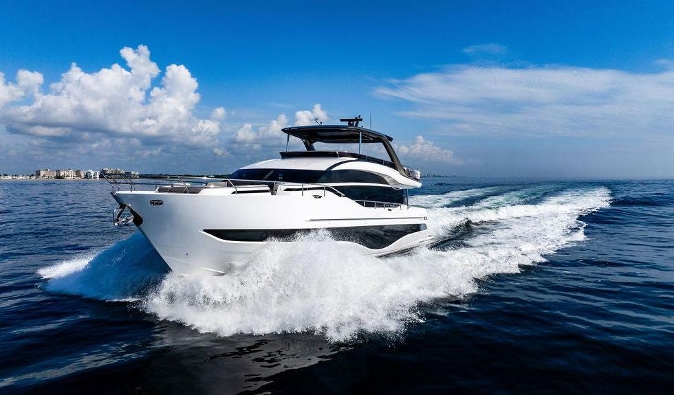 a white yacht on the water aboard GYPZY Yacht for Charter