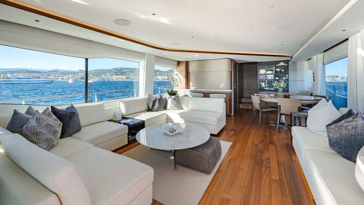 a living room with a large window aboard GYPZY Yacht for Charter