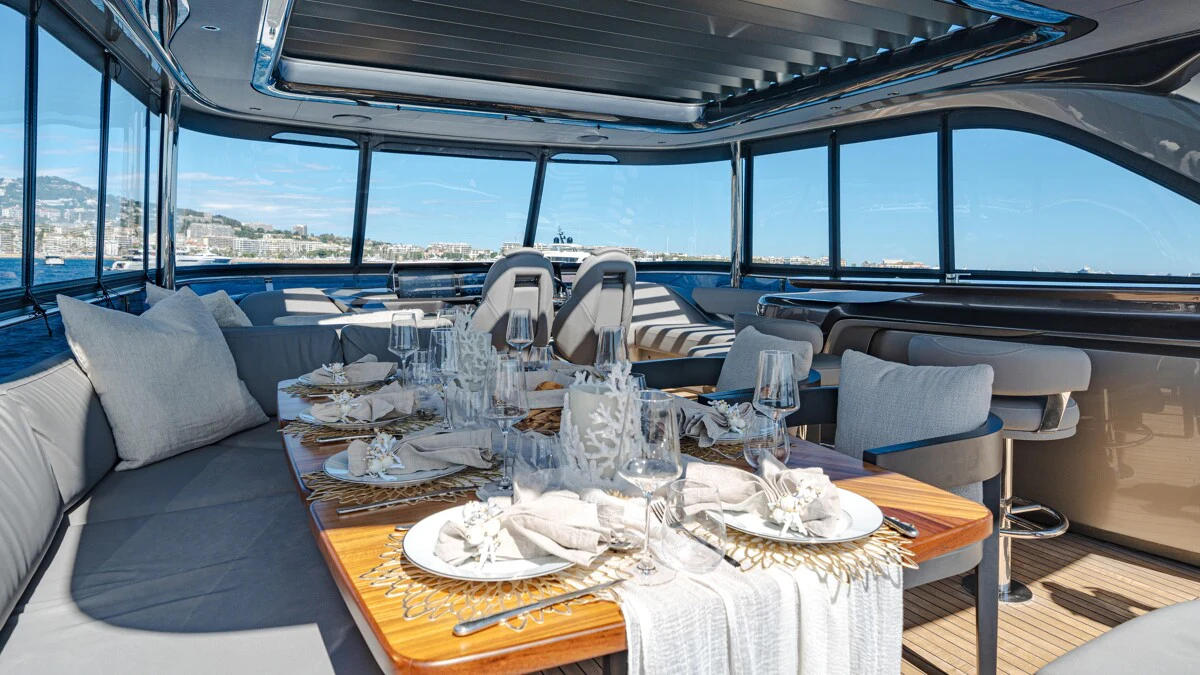 a table set for a dinner aboard GYPZY Yacht for Charter