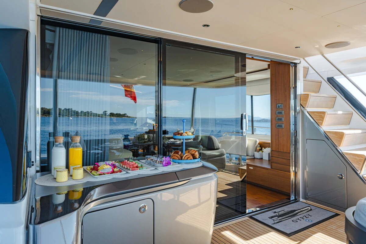 a kitchen with a glass door aboard GYPZY Yacht for Charter