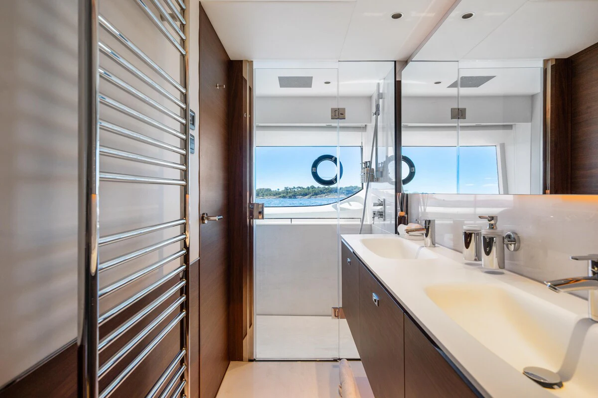 a bathroom with a glass shower aboard GYPZY Yacht for Charter