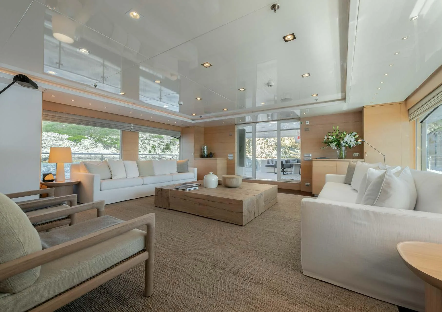 a living room with a large open window aboard ZIA Yacht for Charter