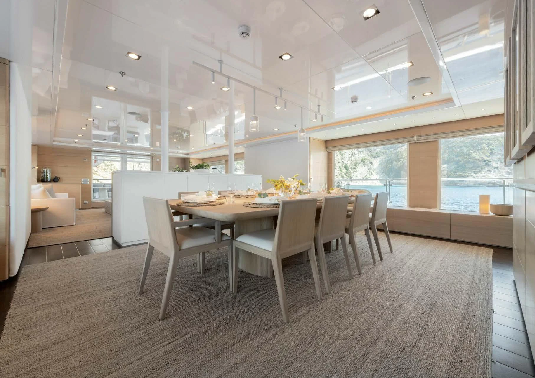 a large room with a table and chairs aboard ZIA Yacht for Charter