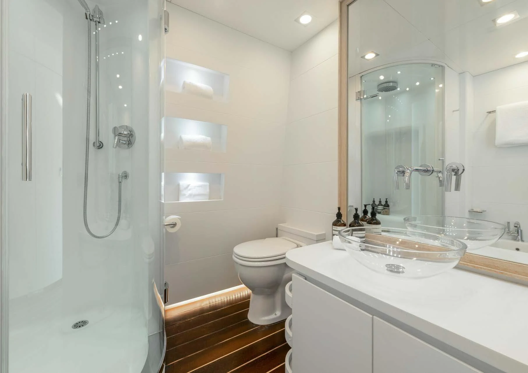 a bathroom with a sink toilet and shower aboard ZIA Yacht for Charter