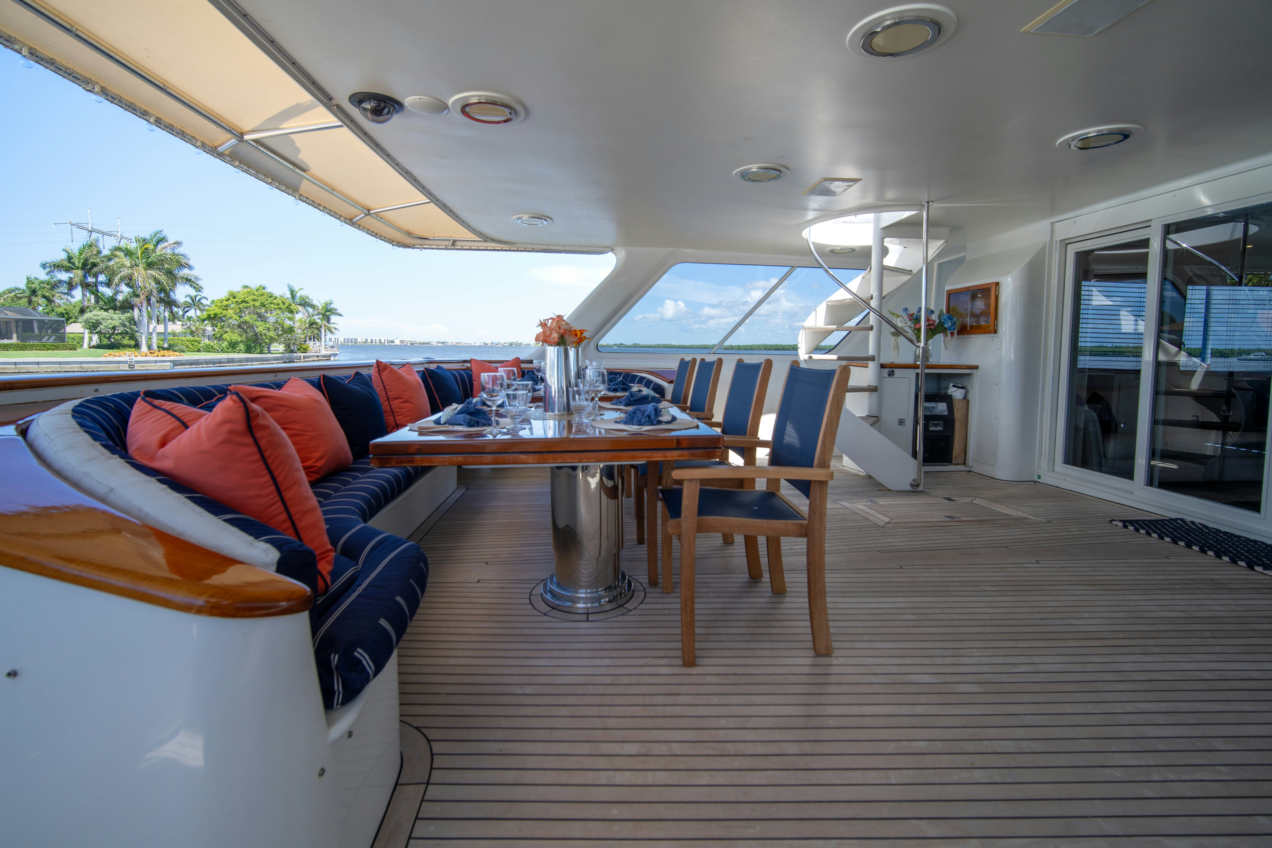 a boat with a table and chairs aboard FLYING DUTCHMAN Yacht for Sale
