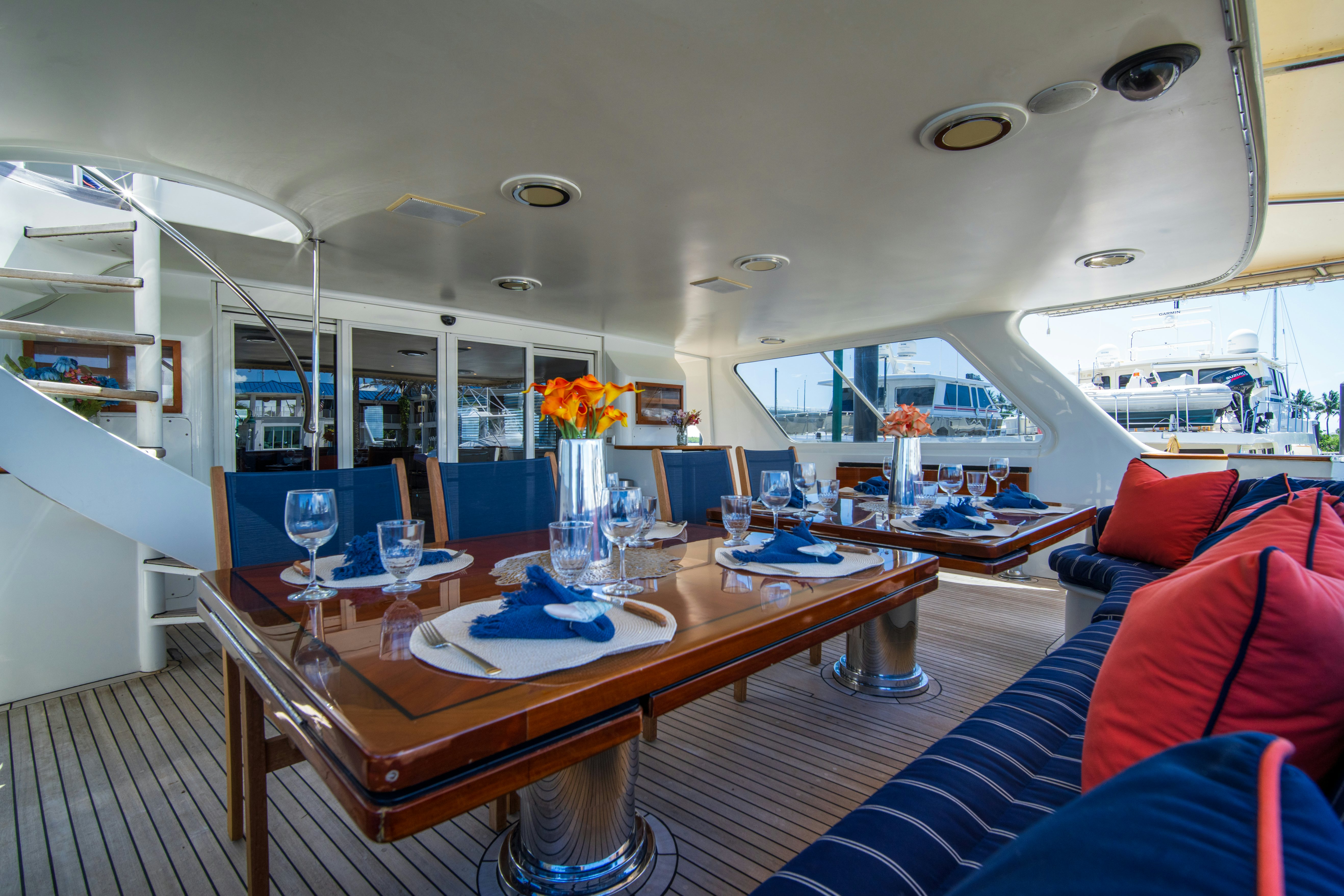 a large room with a table and chairs aboard FLYING DUTCHMAN Yacht for Sale