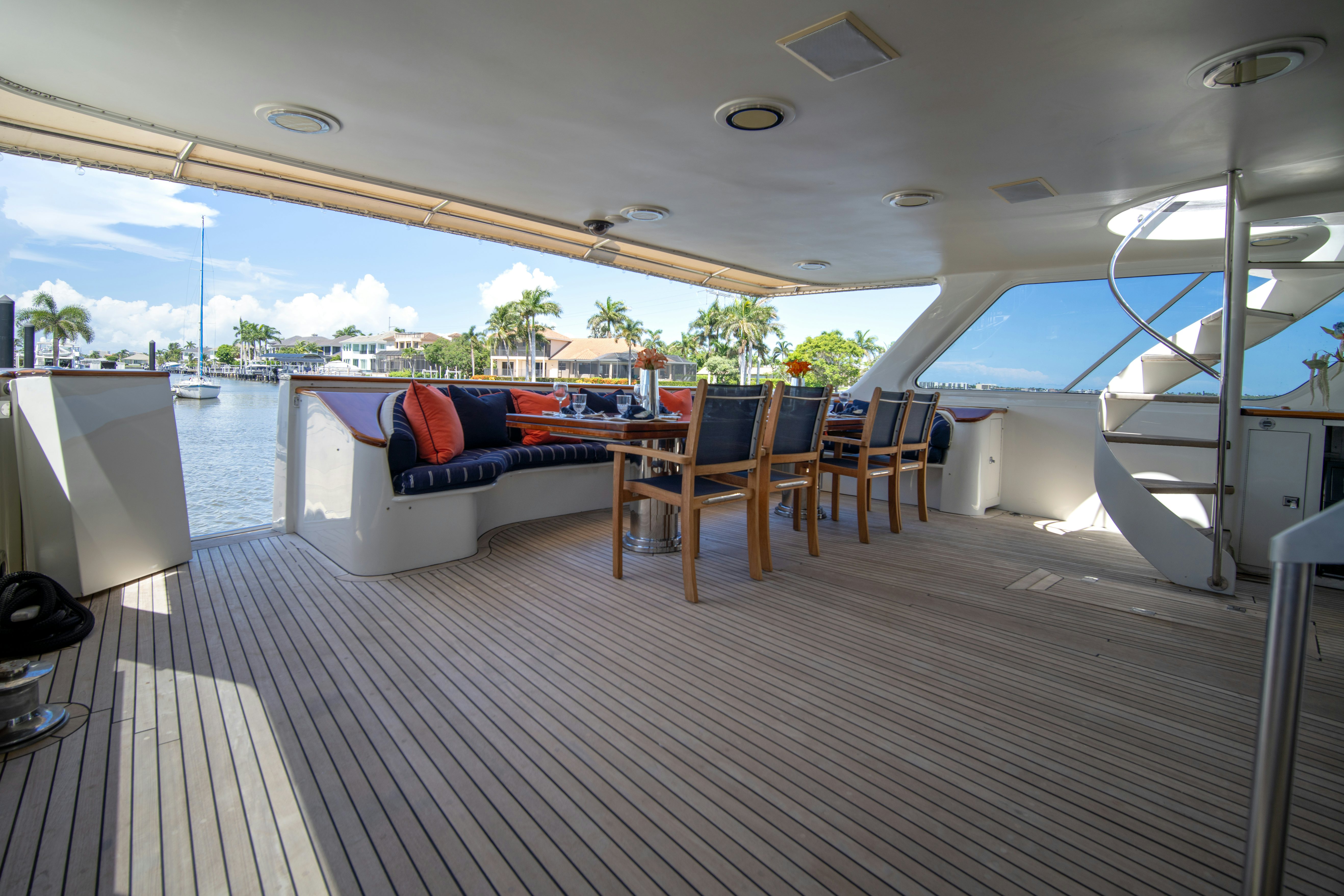 a deck with a couch and chairs aboard FLYING DUTCHMAN Yacht for Sale