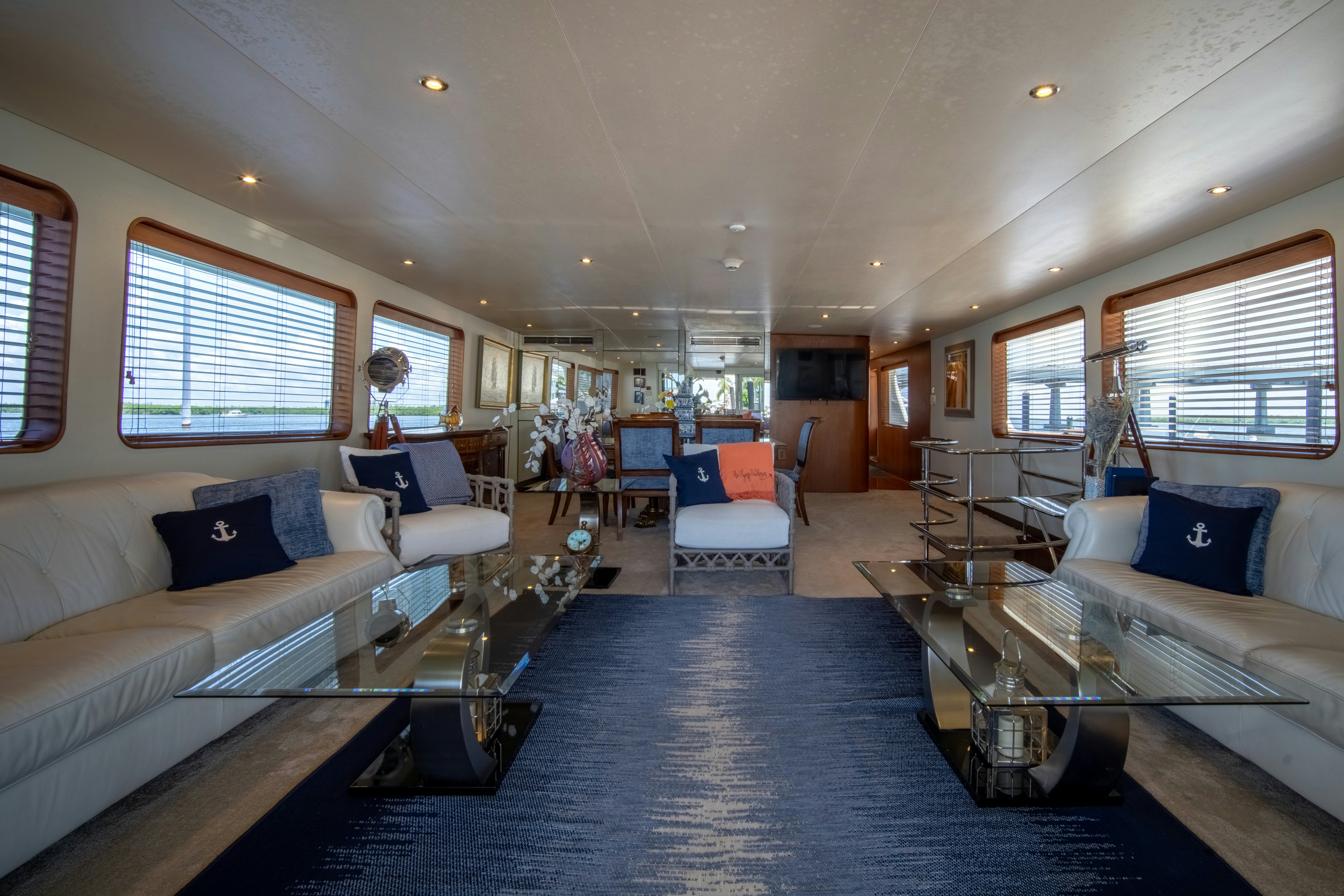 a living room with a large bed aboard FLYING DUTCHMAN Yacht for Sale