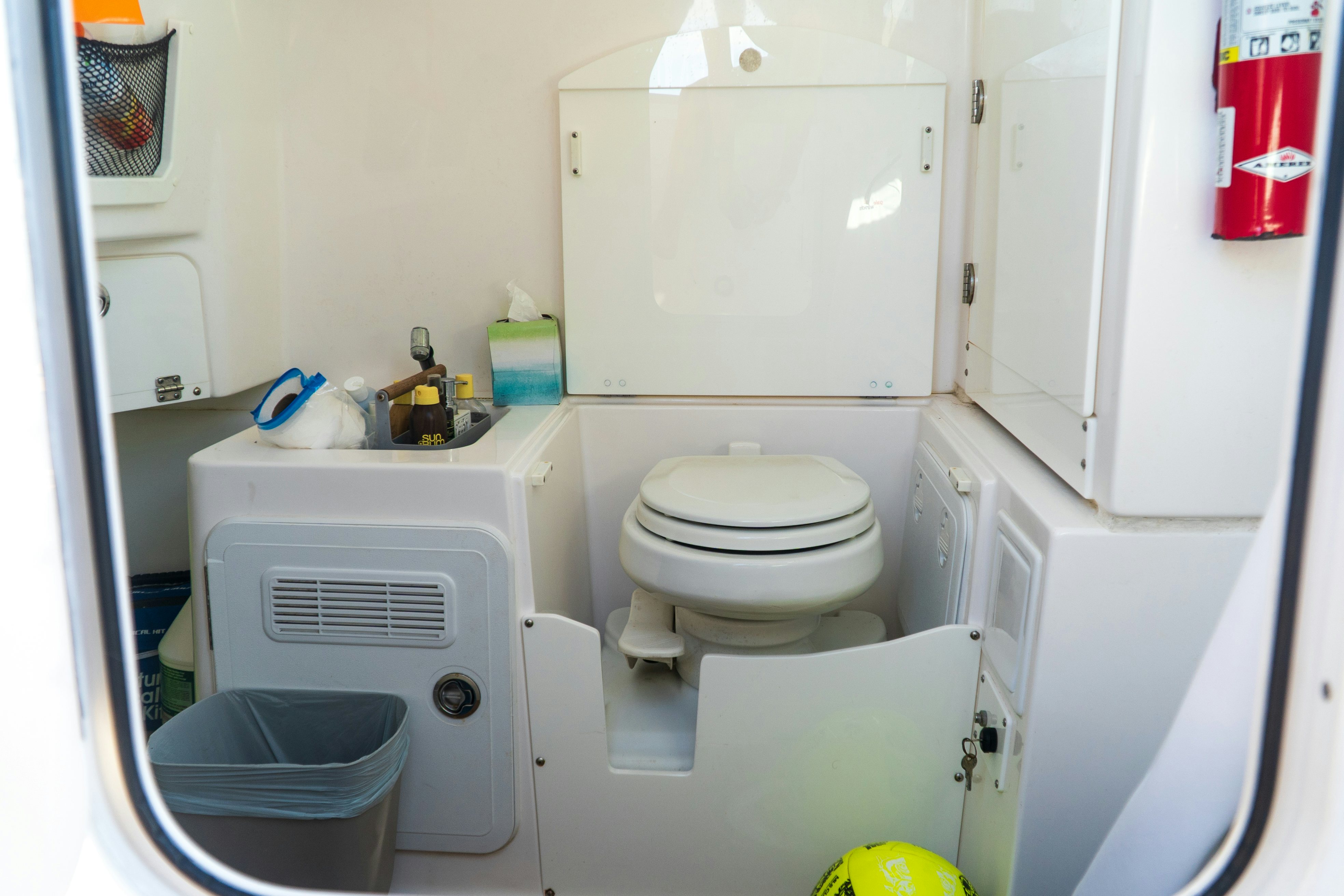 a small bathroom with a toilet aboard LOVE ME TENDER Yacht for Sale