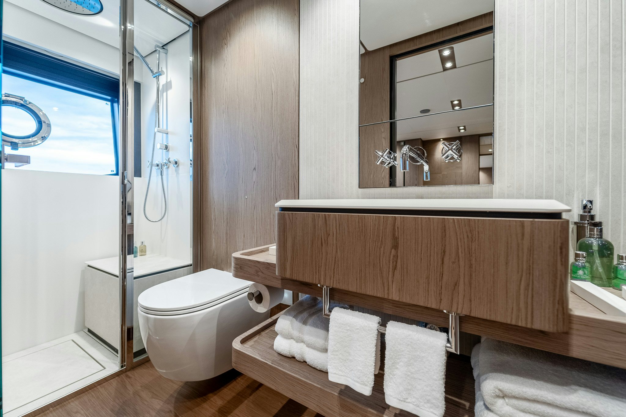 a bathroom with a wooden bench aboard ISOTTA Yacht for Sale