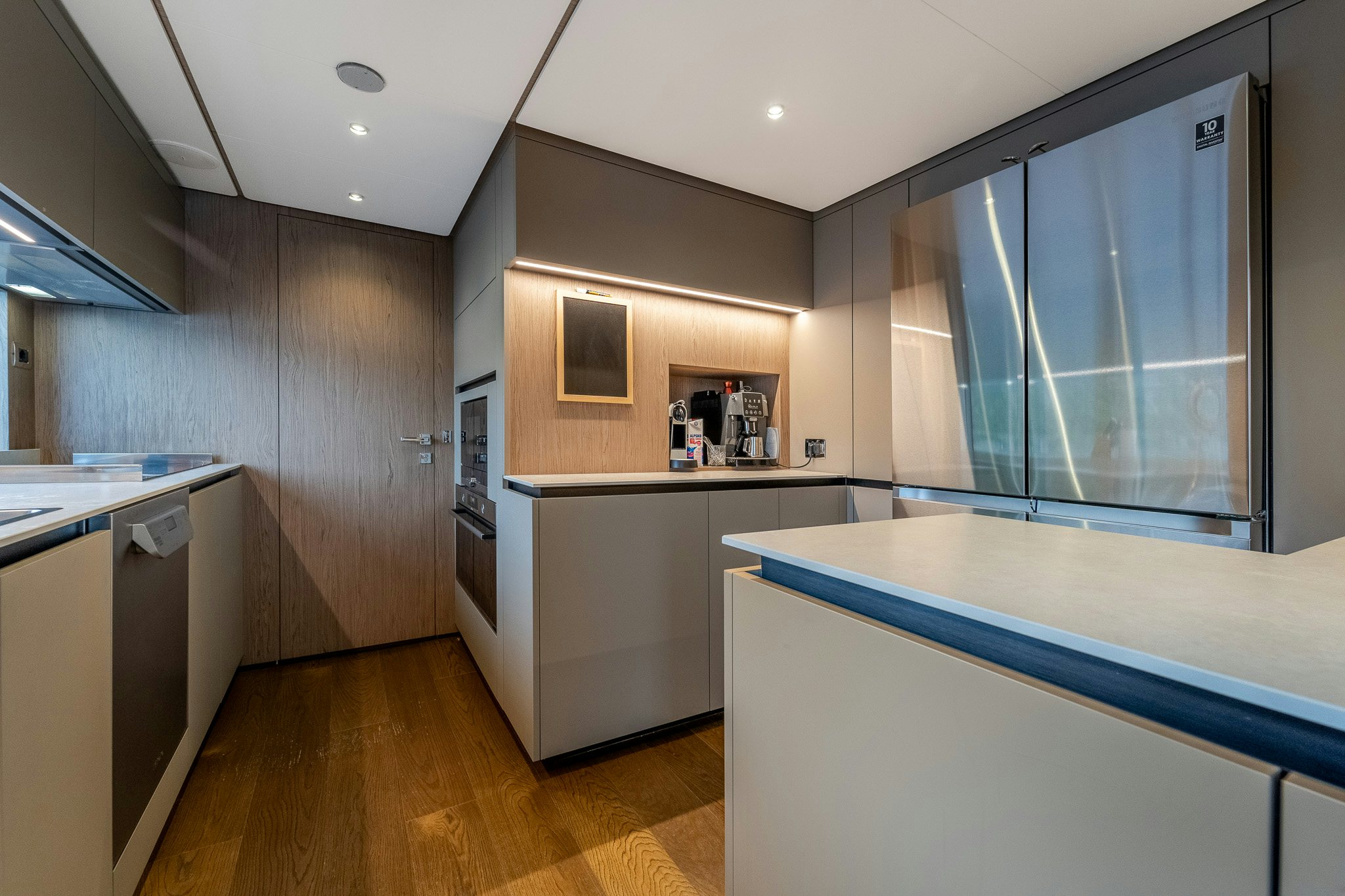 a kitchen with a blue counter aboard ISOTTA Yacht for Sale