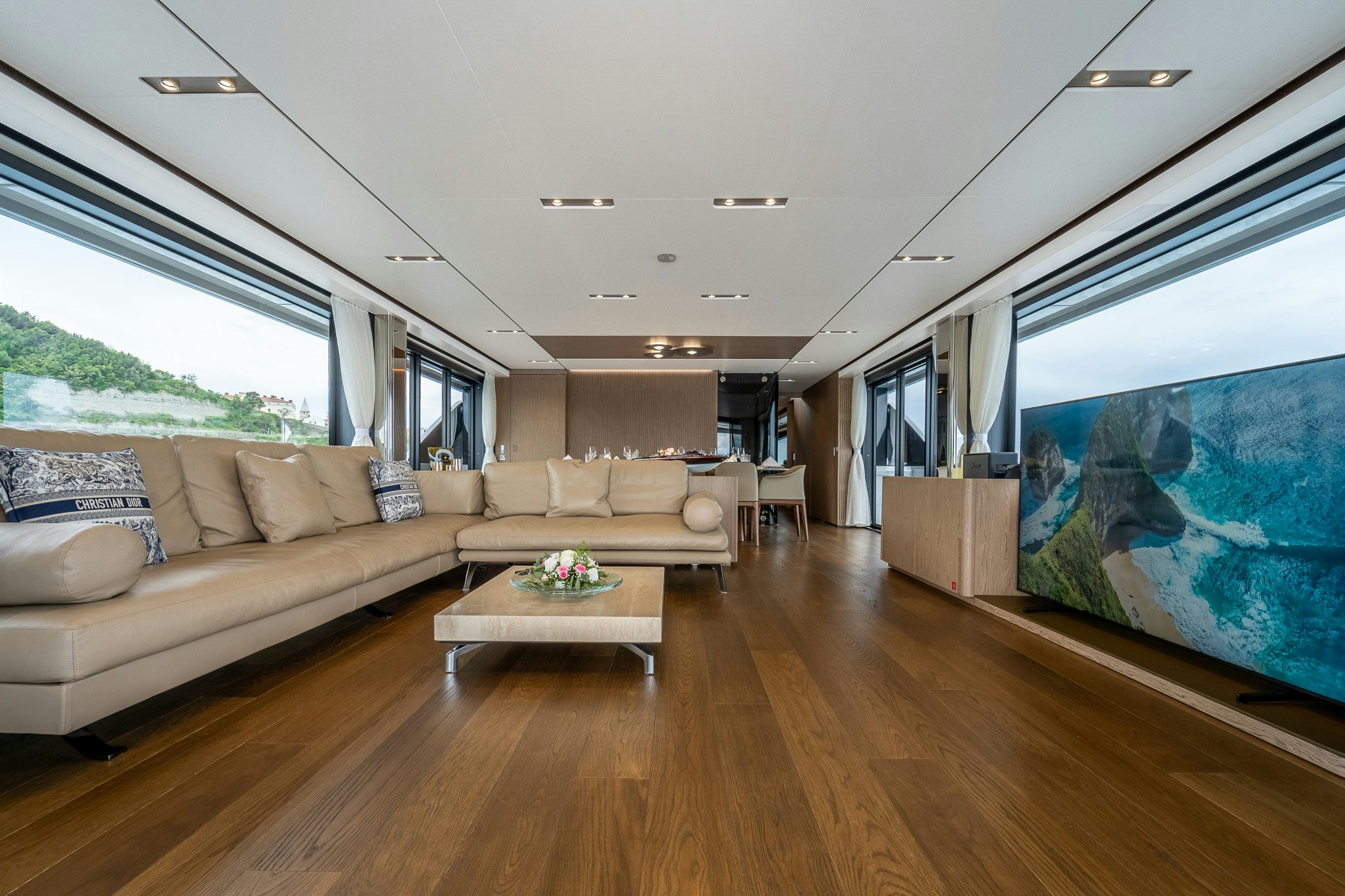 a living room with a large window aboard ISOTTA Yacht for Sale