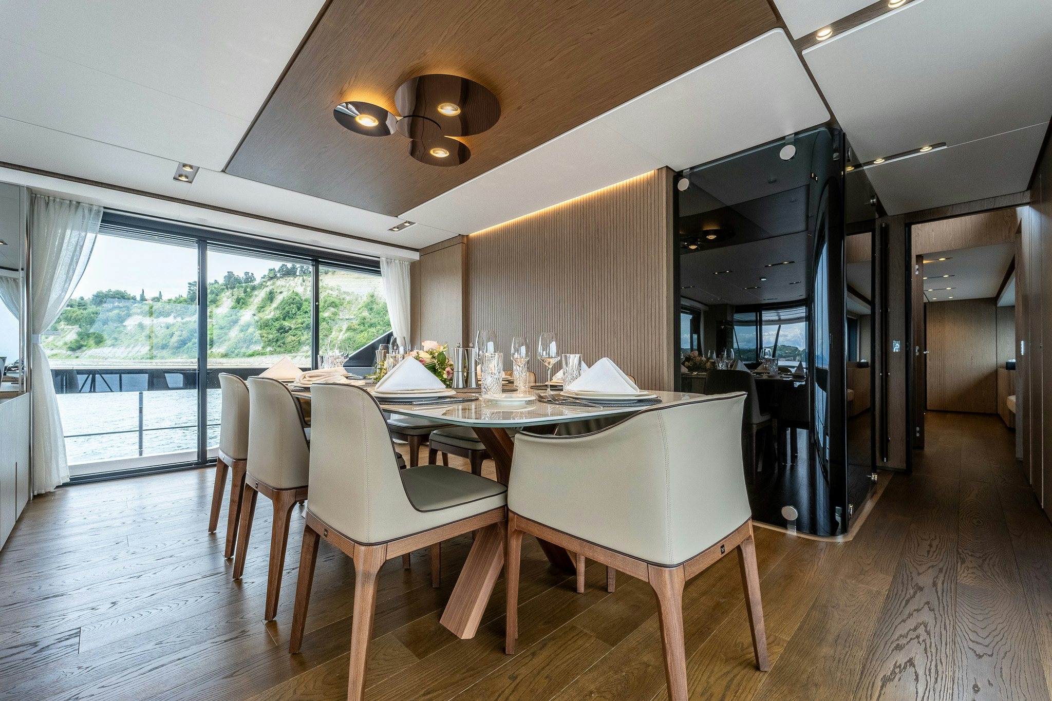 a dining room with a table and chairs aboard ISOTTA Yacht for Sale