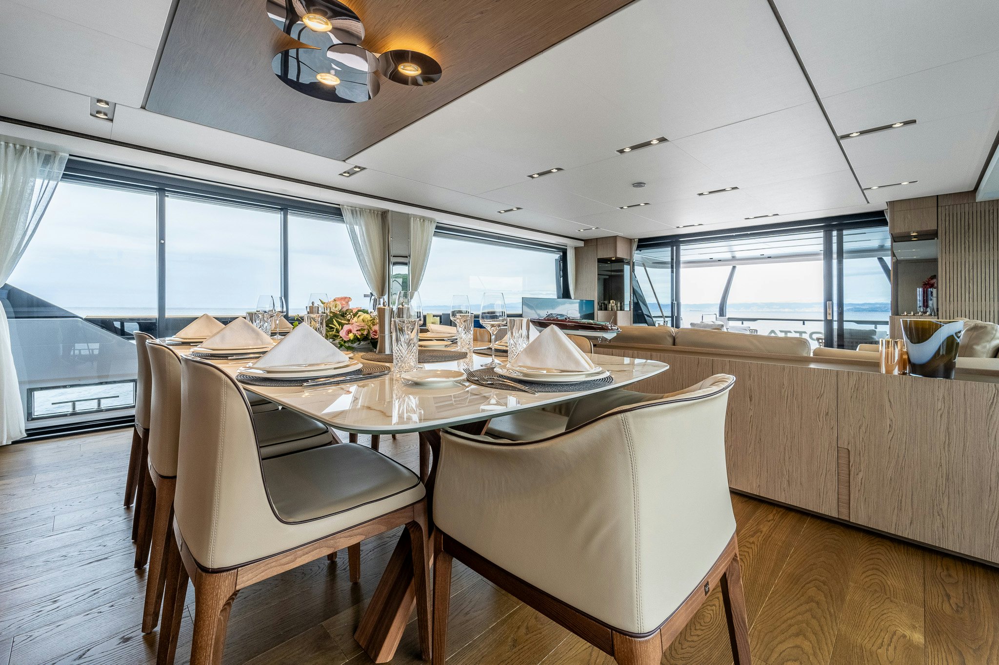 a dining room with a table and chairs aboard ISOTTA Yacht for Sale