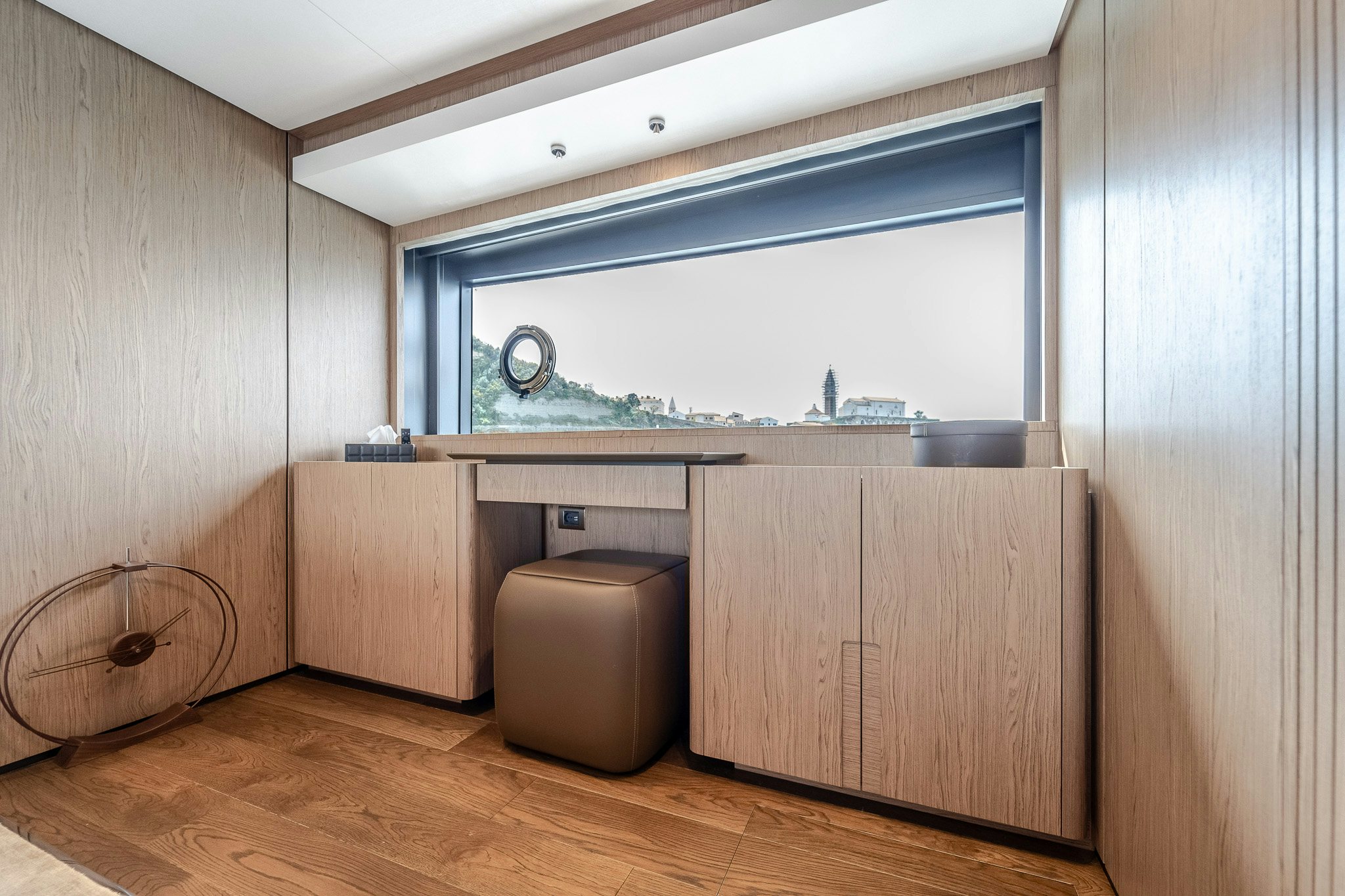 a room with a window and a wood floor aboard ISOTTA Yacht for Sale