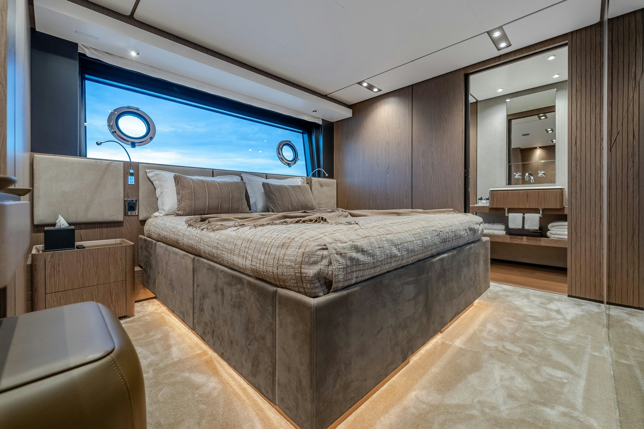 a bedroom with a bed and a desk aboard ISOTTA Yacht for Sale