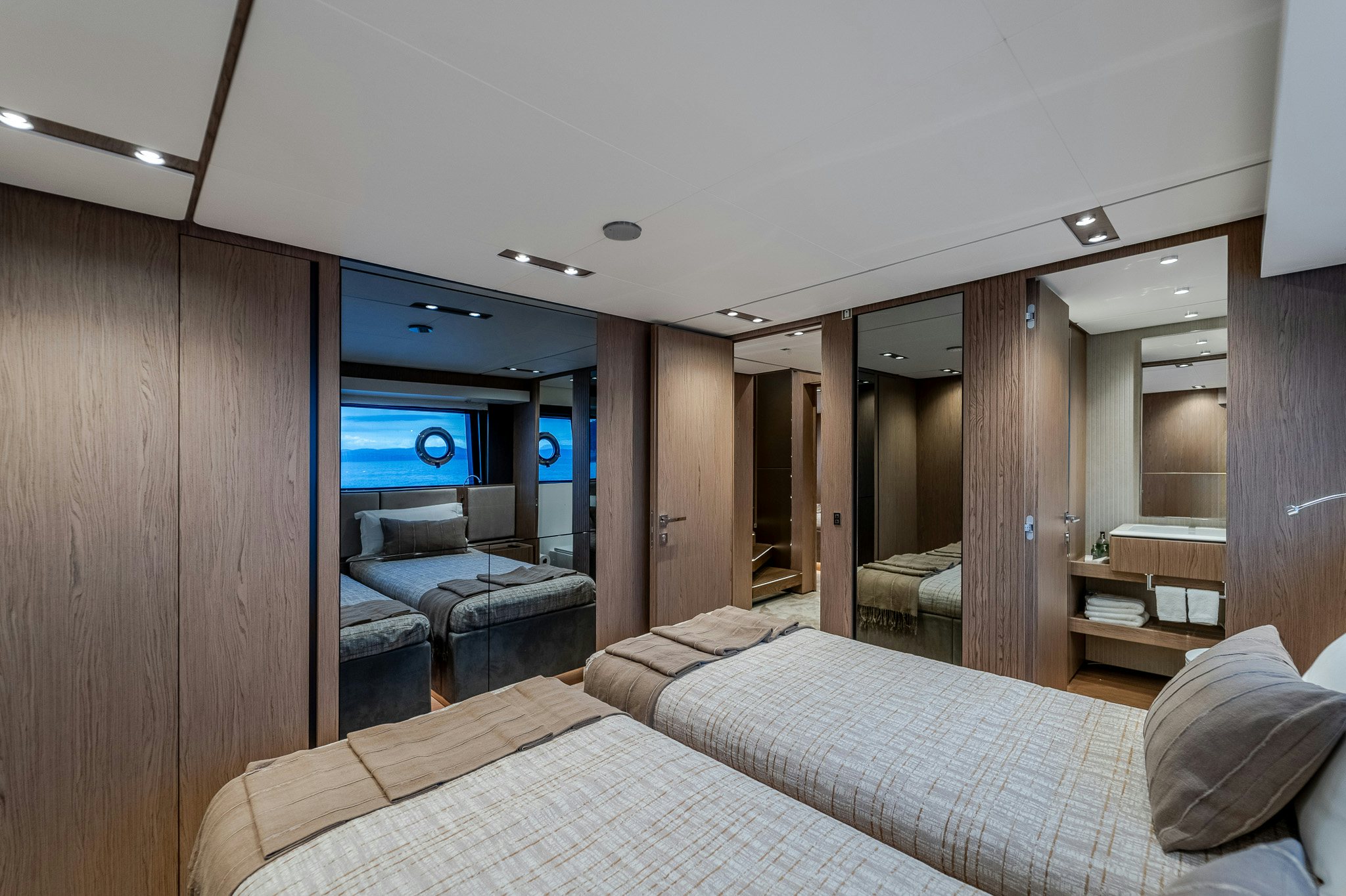a bedroom with a bed and a wood wall aboard ISOTTA Yacht for Sale