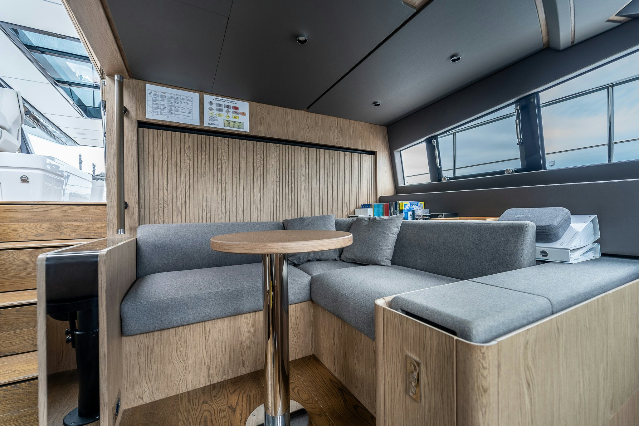 a living room with a couch and a table aboard ISOTTA Yacht for Sale