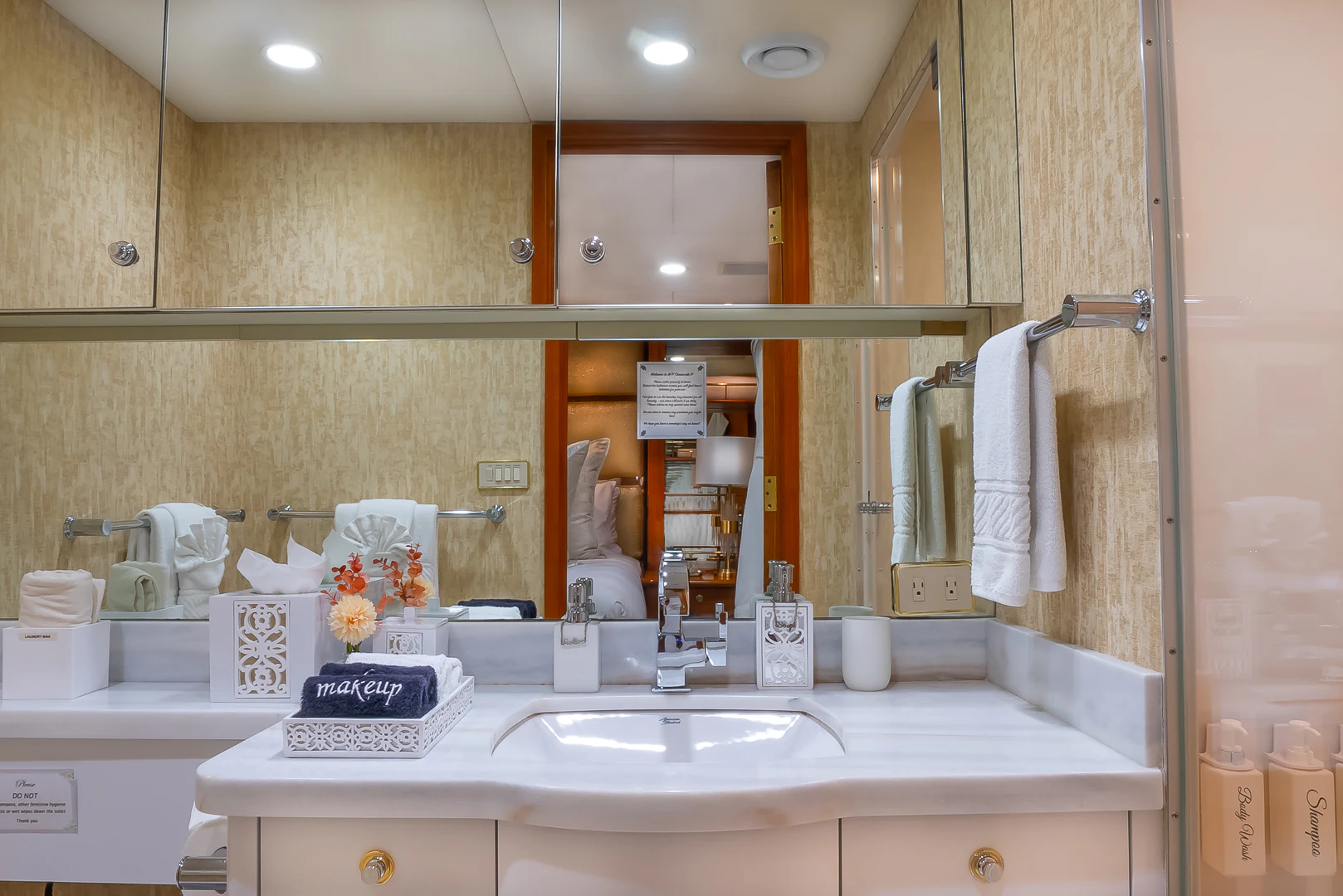 a bathroom with a large mirror aboard GALE WINDS Yacht for Charter