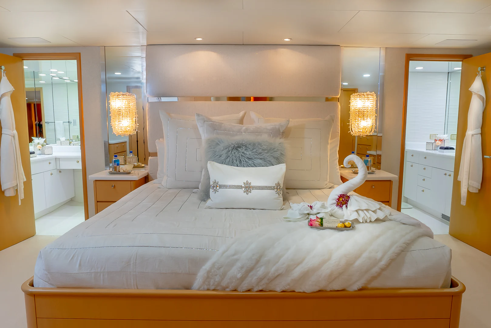 a bed with a white pillow and a white bed spread aboard GALE WINDS Yacht for Charter