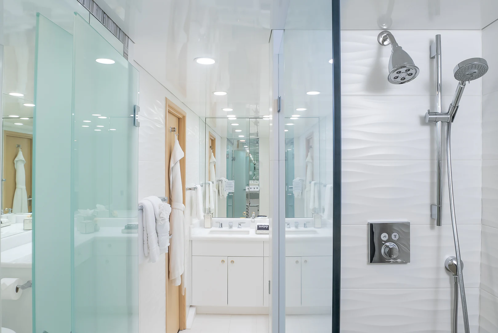 a bathroom with a glass shower aboard GALE WINDS Yacht for Charter