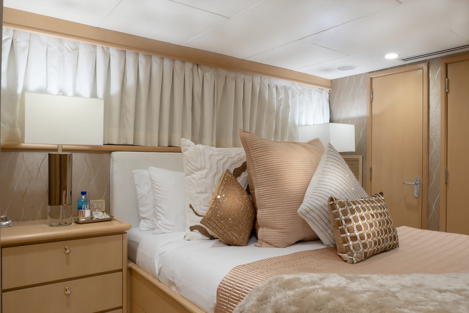 a bed with pillows and pillows aboard GALE WINDS Yacht for Charter