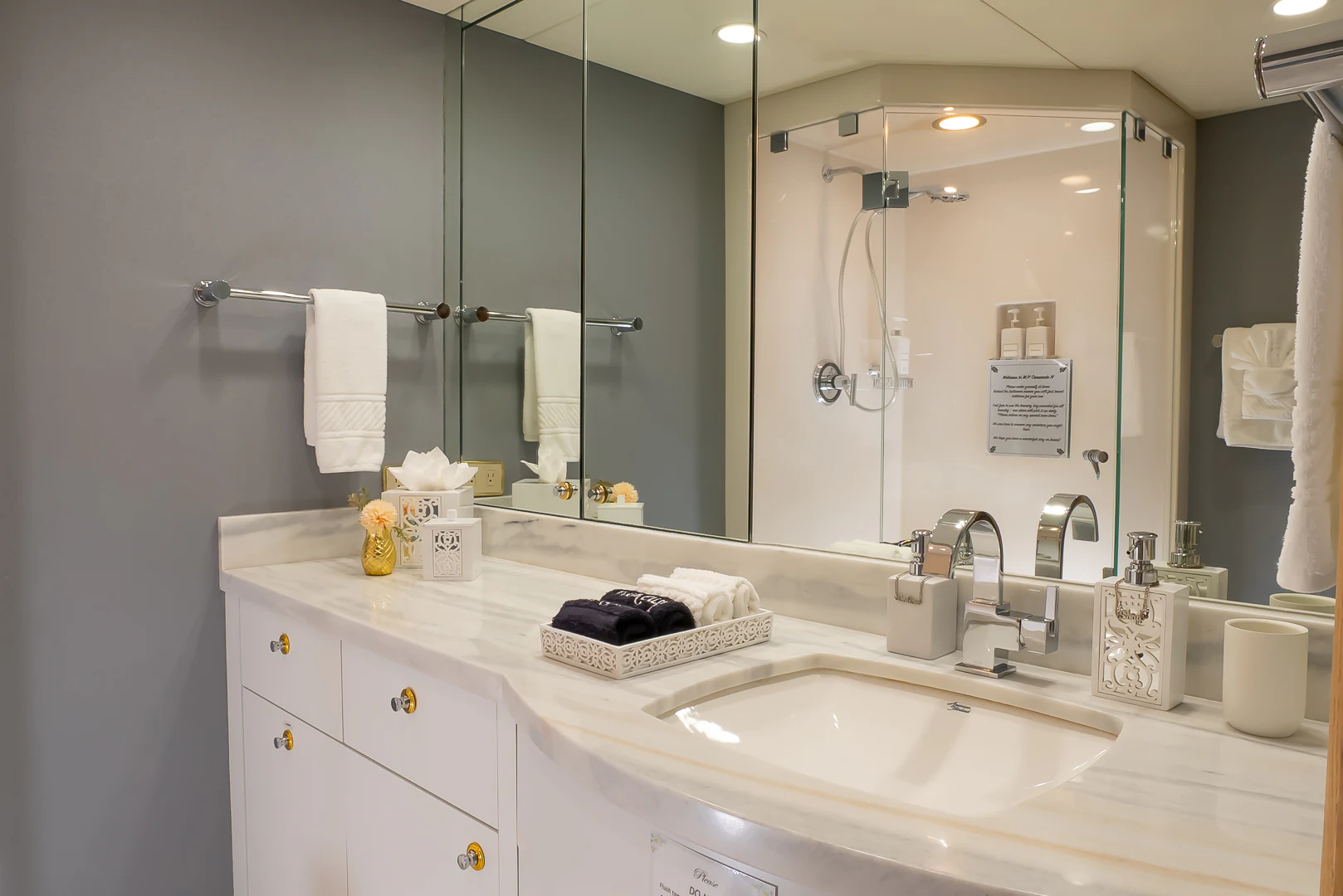 a bathroom with a large mirror aboard GALE WINDS Yacht for Charter