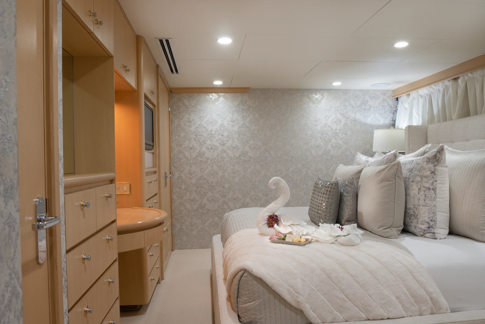 a bedroom with a bed and a sink aboard GALE WINDS Yacht for Charter