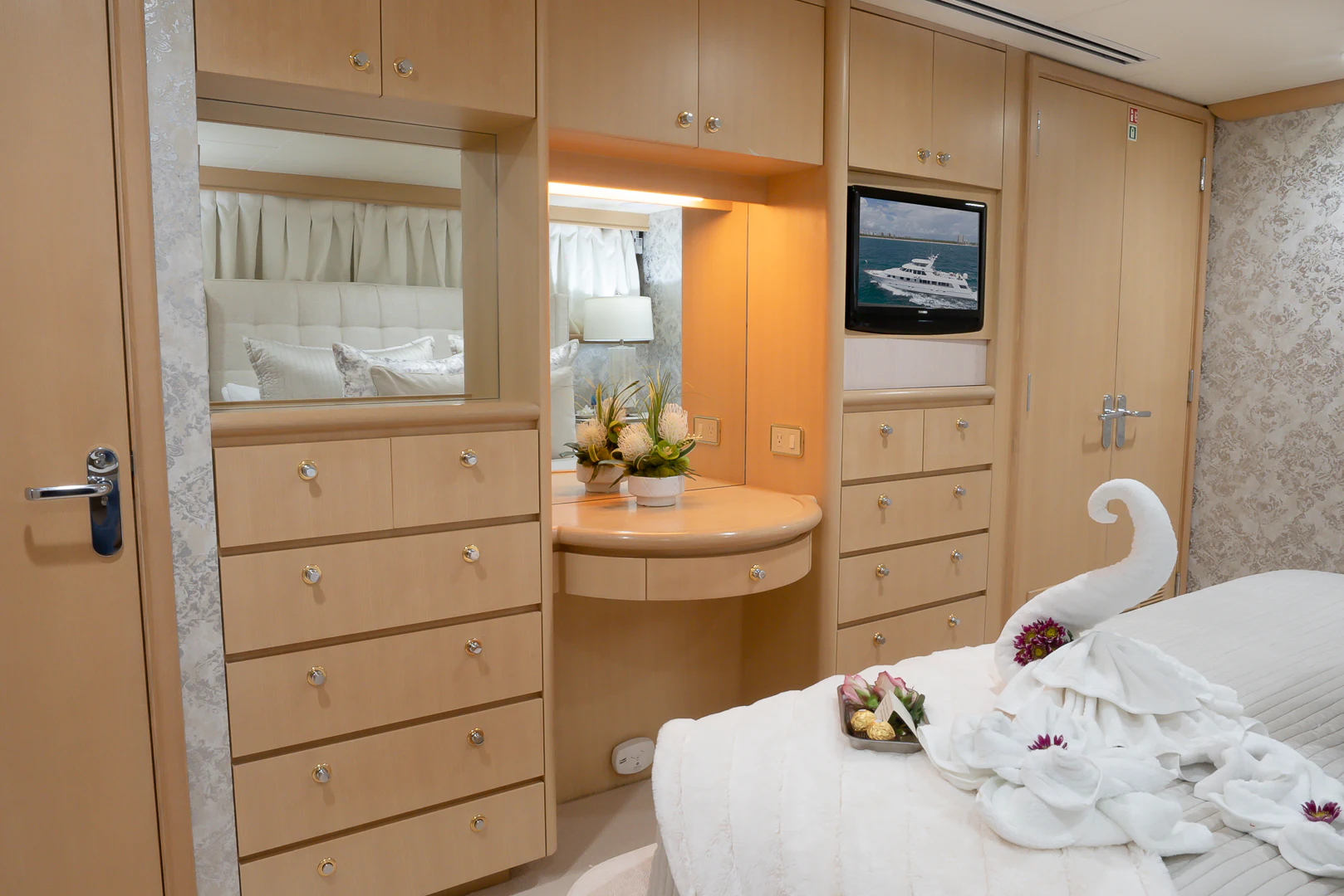 a room with a bed and a desk aboard GALE WINDS Yacht for Charter