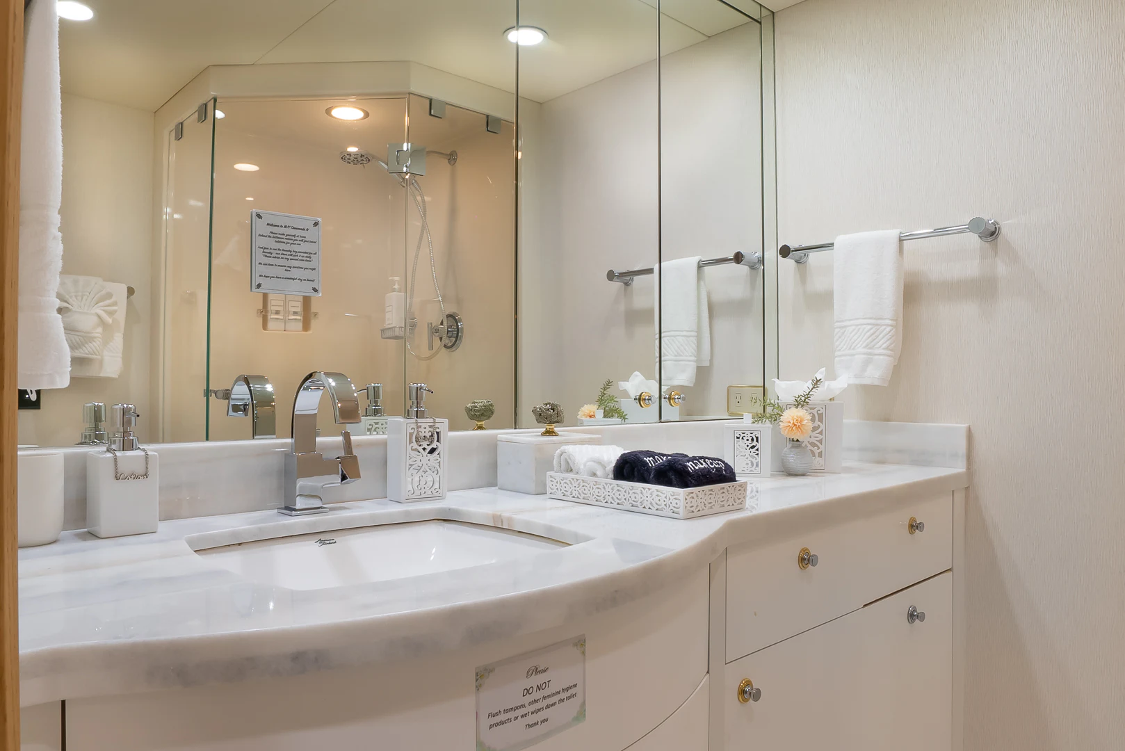 a bathroom with a large mirror aboard GALE WINDS Yacht for Charter