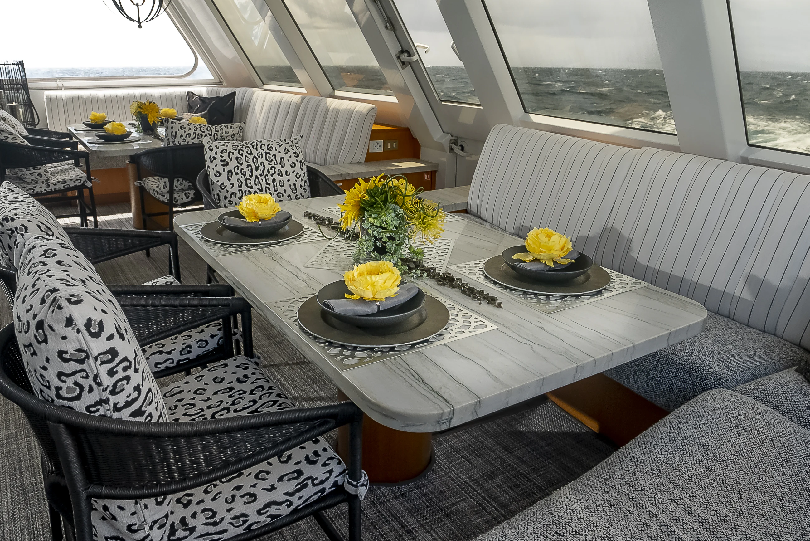 a table with plates and cups on it aboard GALE WINDS Yacht for Charter