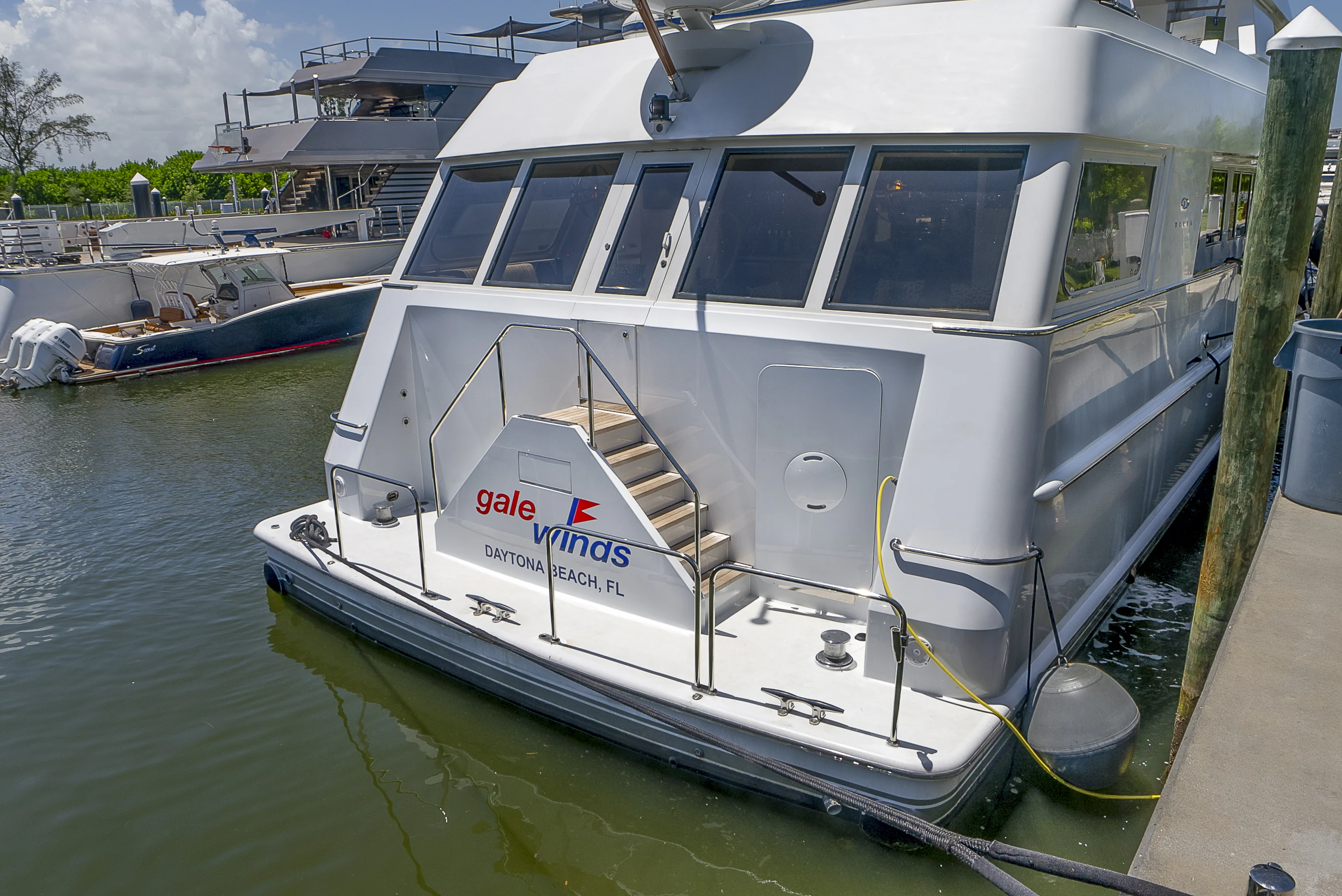 a boat docked at a pier aboard GALE WINDS Yacht for Charter