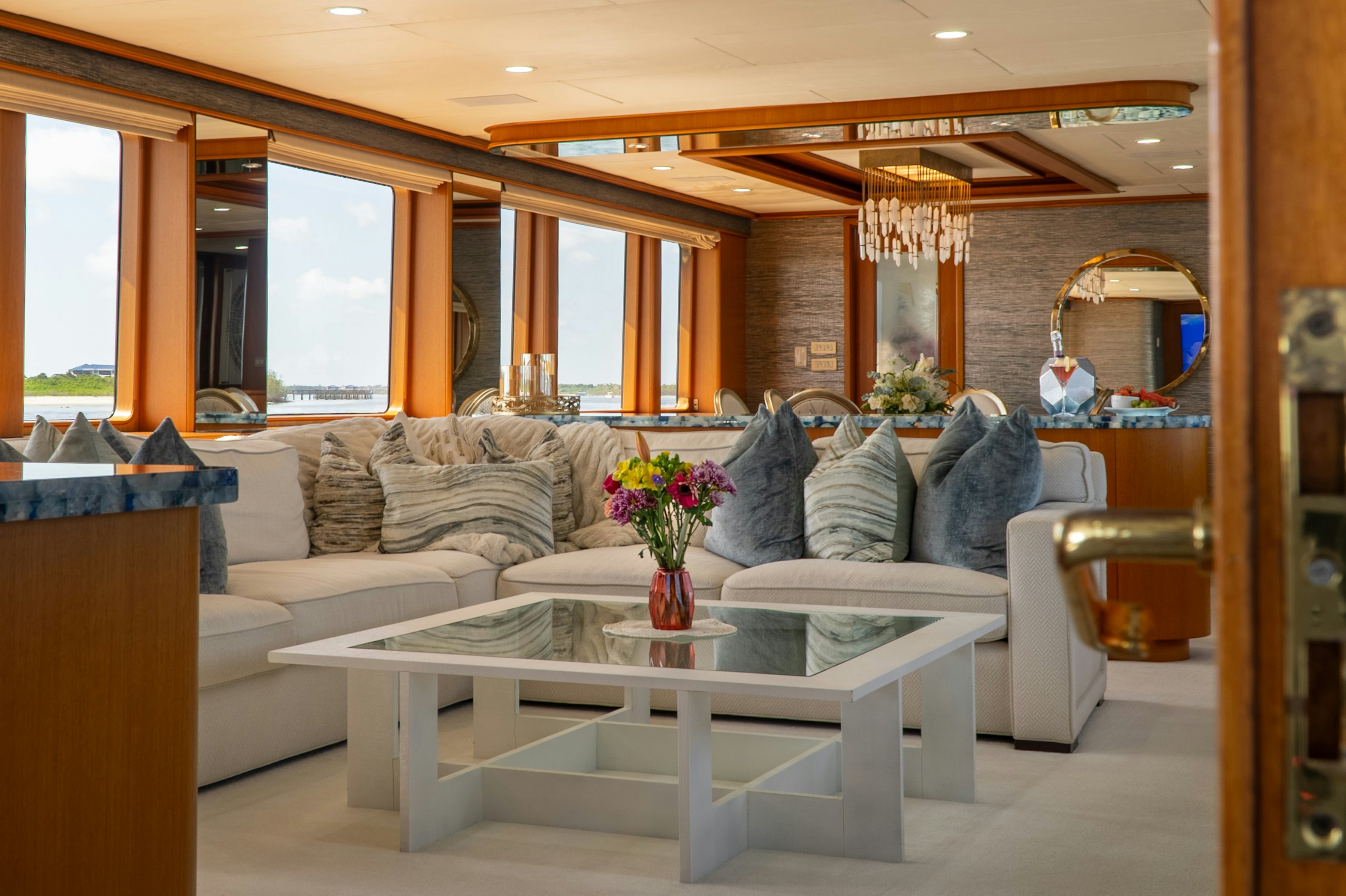 a living room with a couch and a table aboard GALE WINDS Yacht for Sale