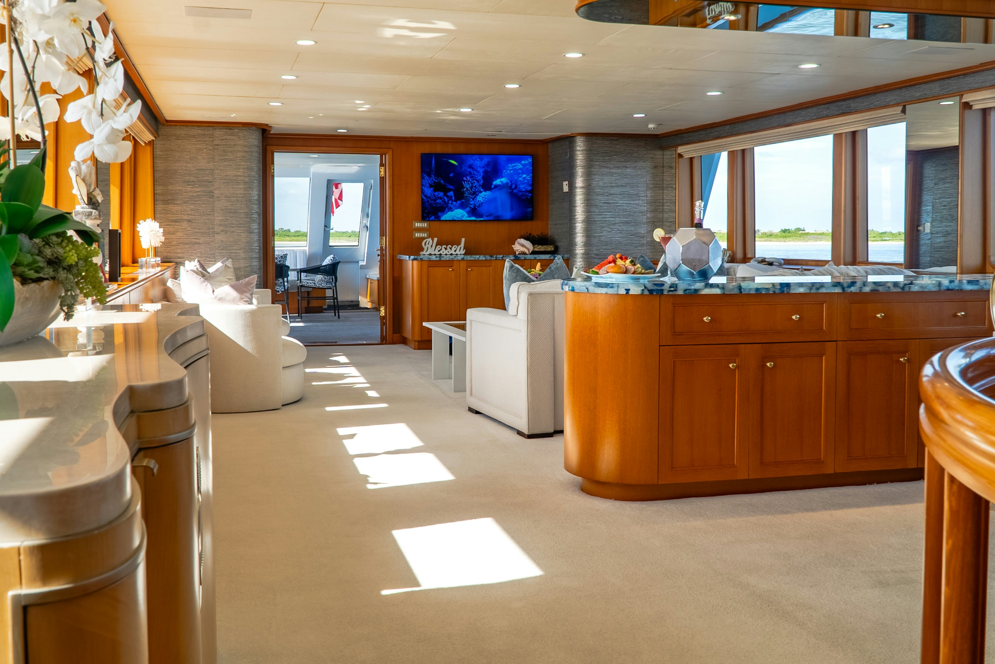 a large room with a counter and chairs aboard GALE WINDS Yacht for Sale