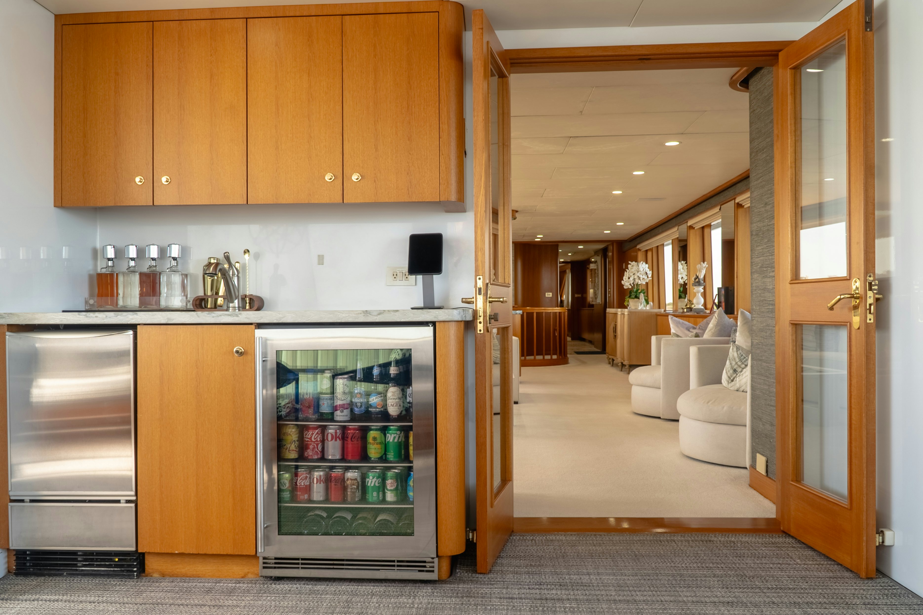 a kitchen with a refrigerator and a sink aboard GALE WINDS Yacht for Sale