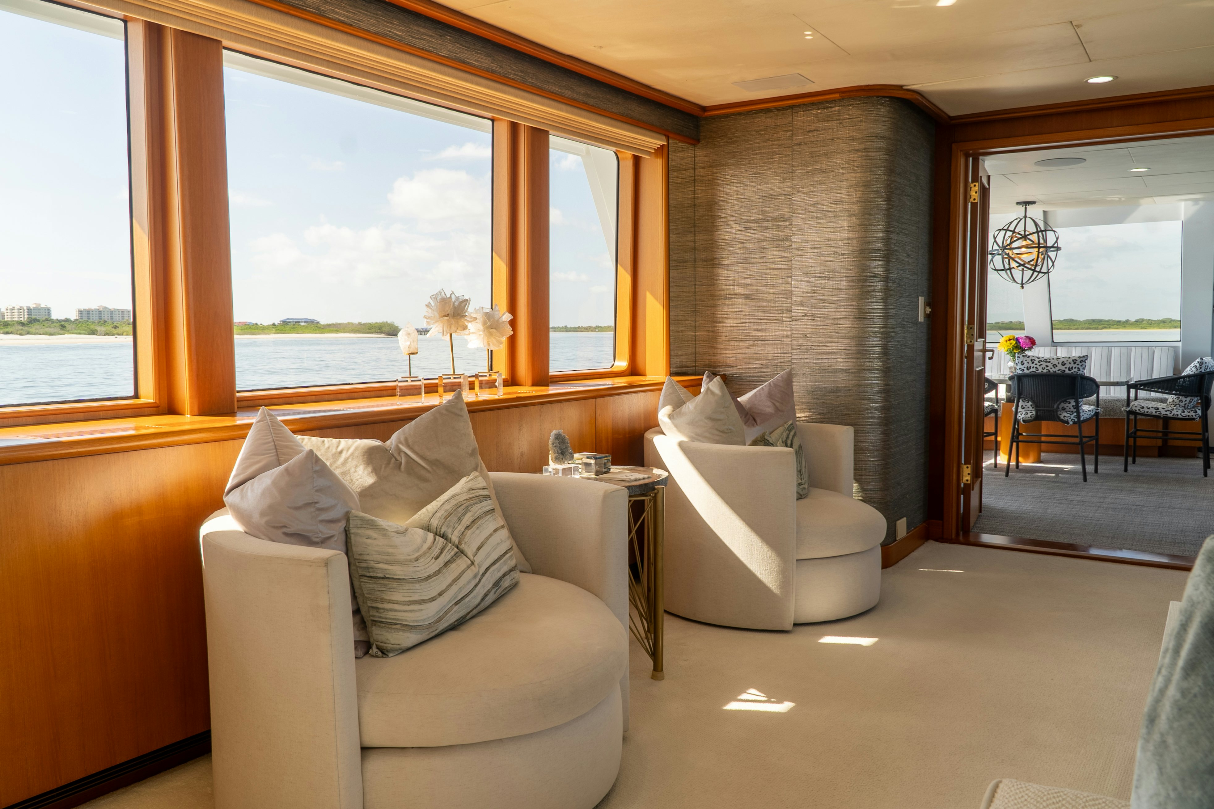 a living room with a couch and a window aboard GALE WINDS Yacht for Sale