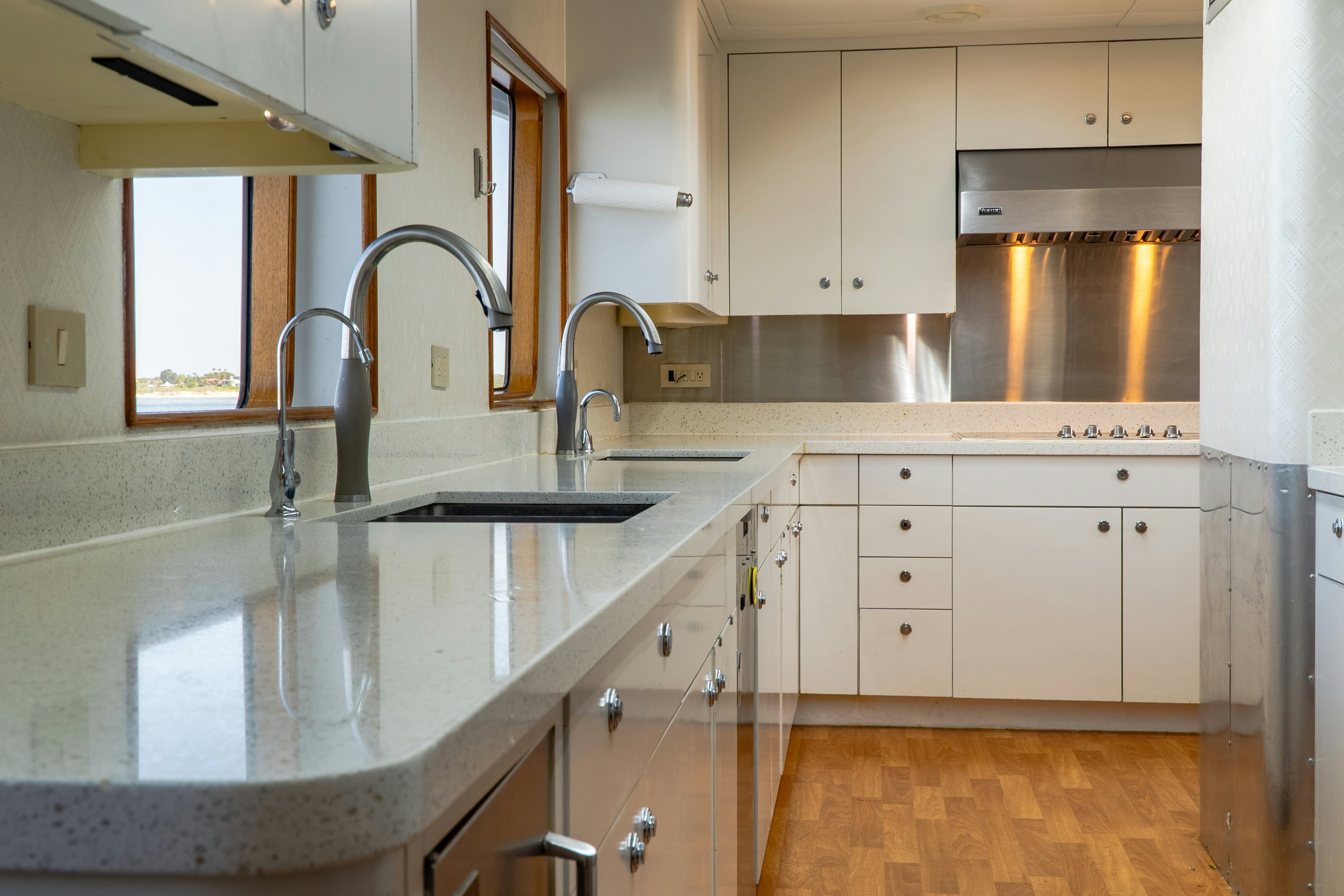a kitchen with a sink and a faucet aboard GALE WINDS Yacht for Sale