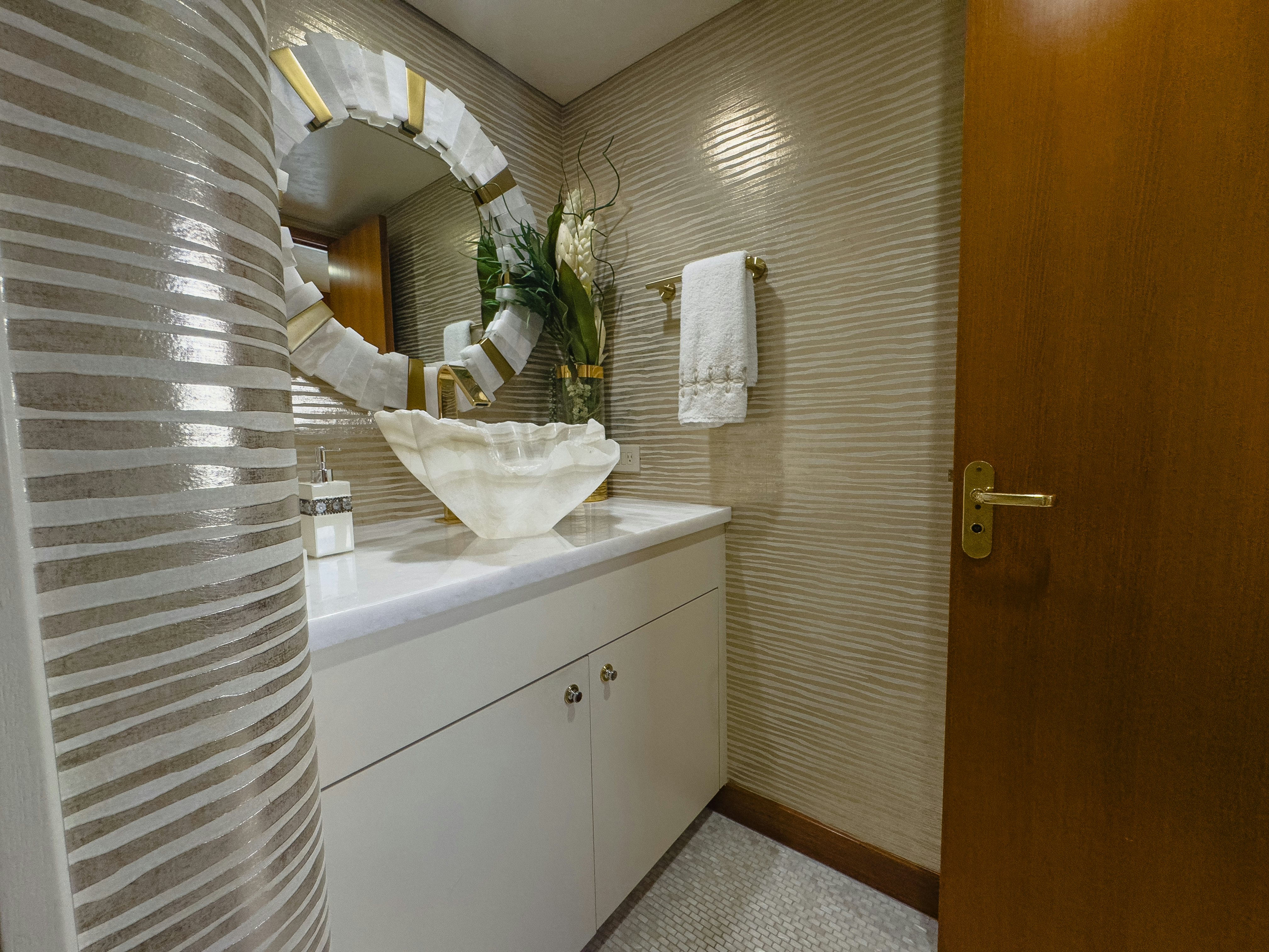 a bathroom with a sink and towels aboard GALE WINDS Yacht for Sale