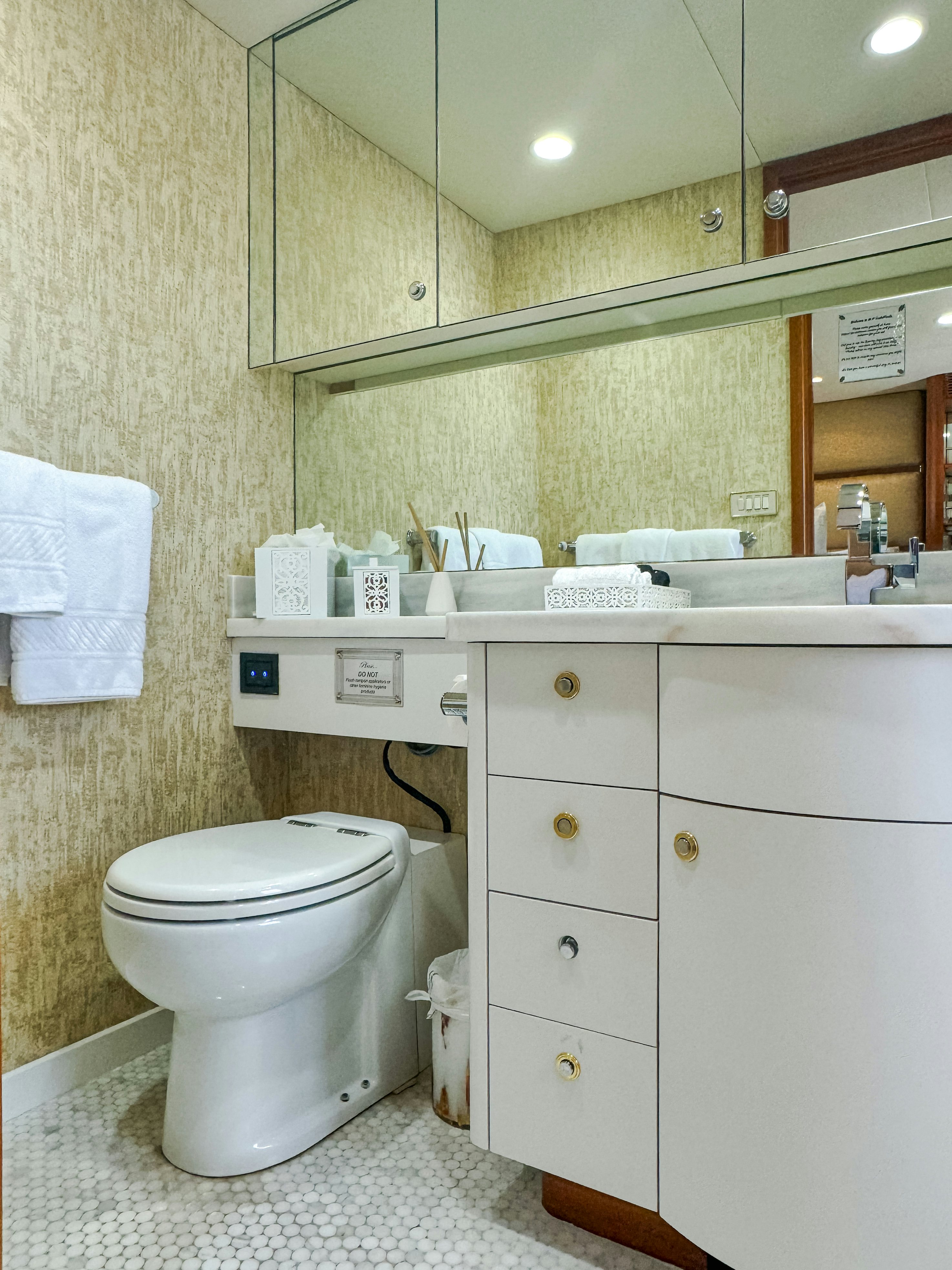 a bathroom with a toilet and a sink aboard GALE WINDS Yacht for Sale