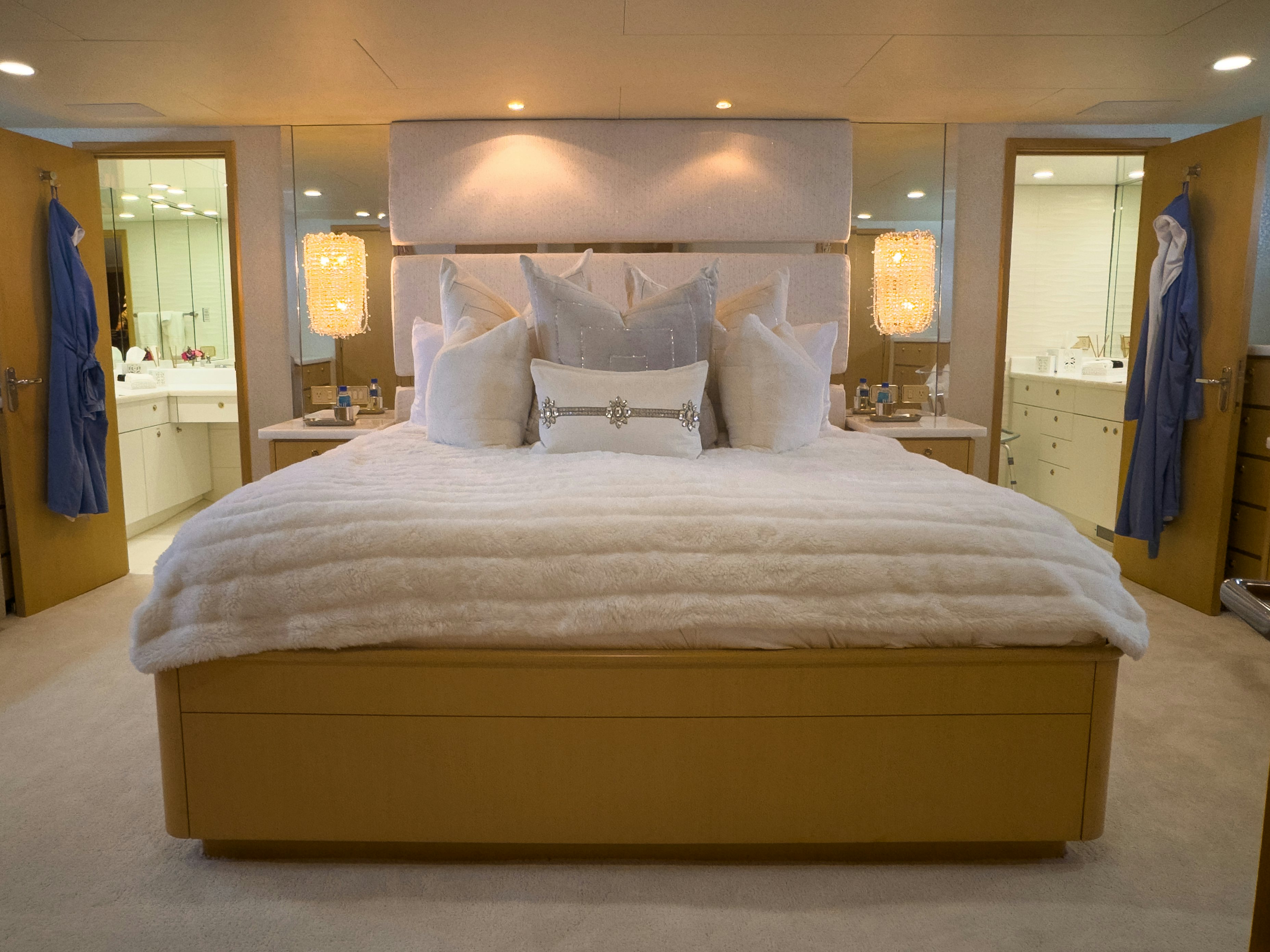 a bed with a white comforter aboard GALE WINDS Yacht for Sale
