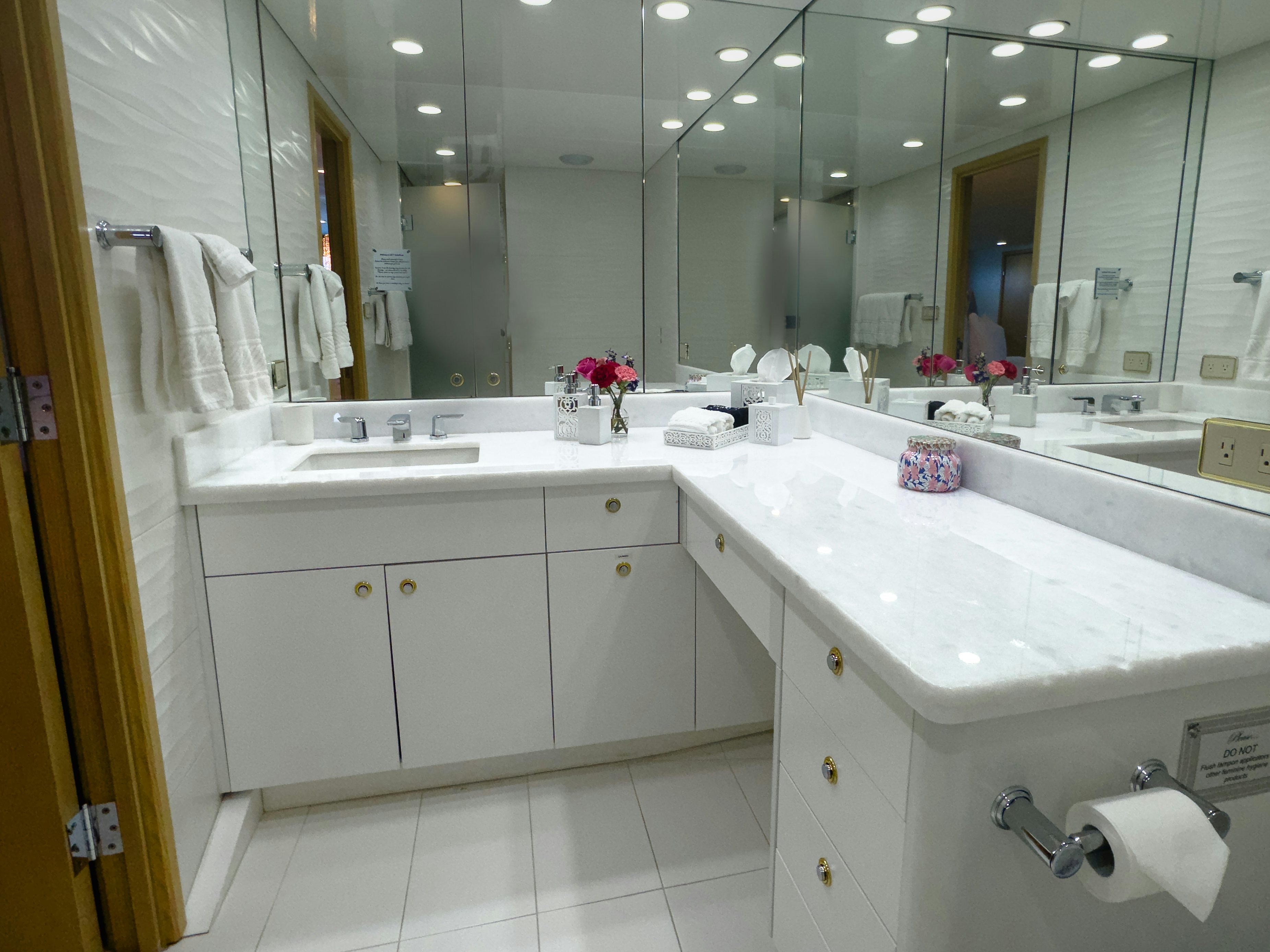 a bathroom with a large mirror aboard GALE WINDS Yacht for Sale