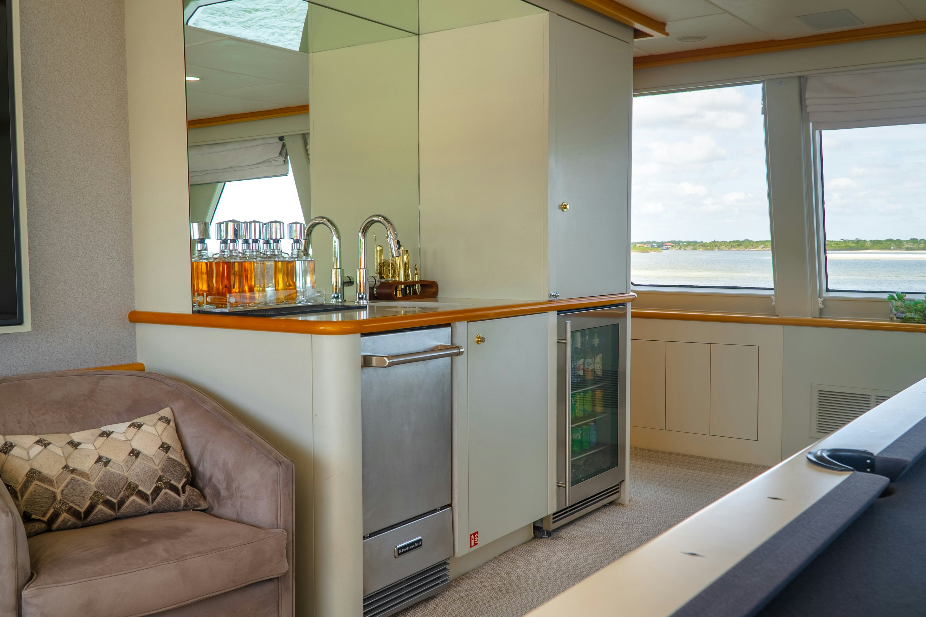 a kitchen with a couch and a microwave aboard GALE WINDS Yacht for Sale
