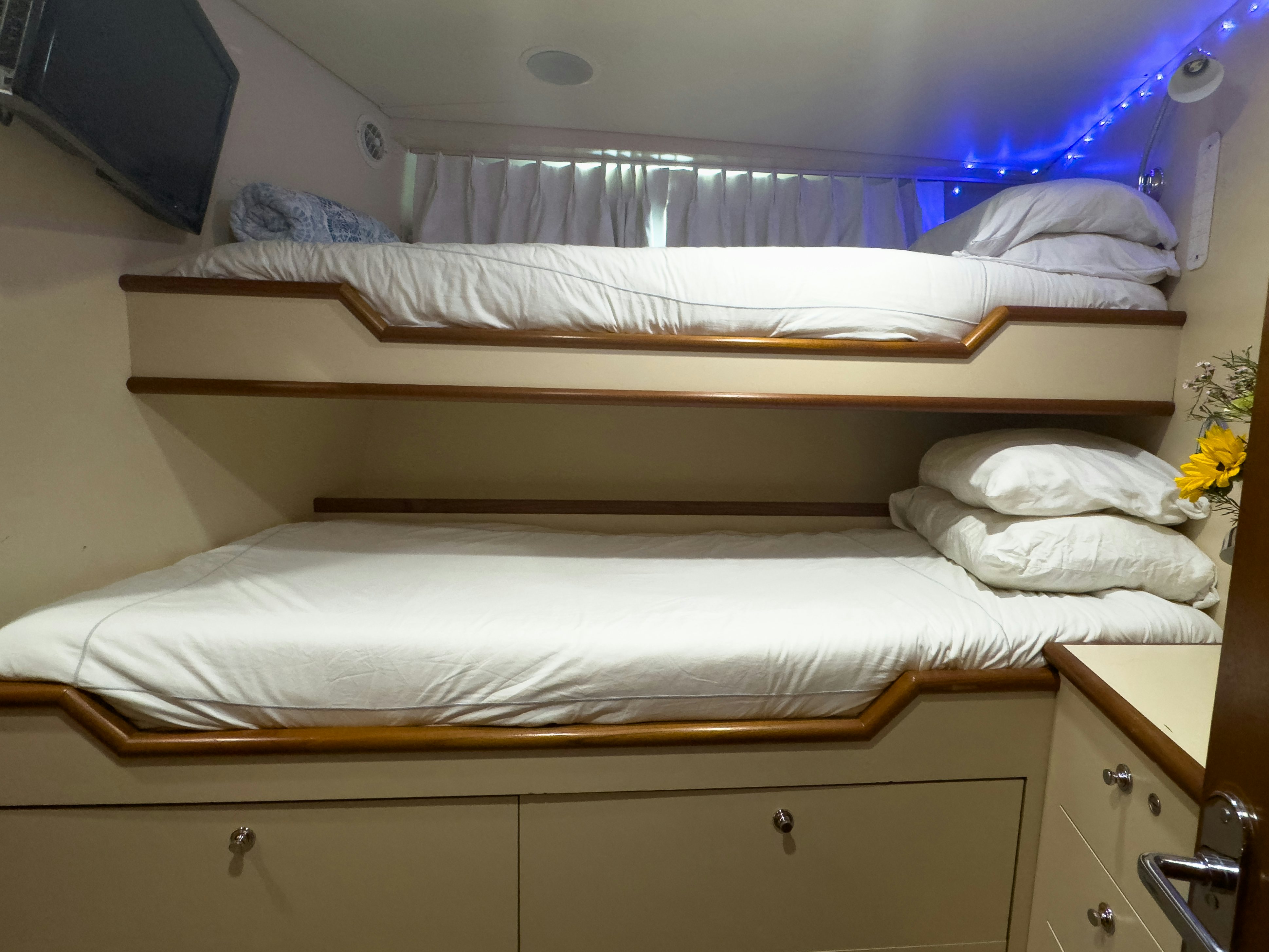a bed with white sheets aboard GALE WINDS Yacht for Sale
