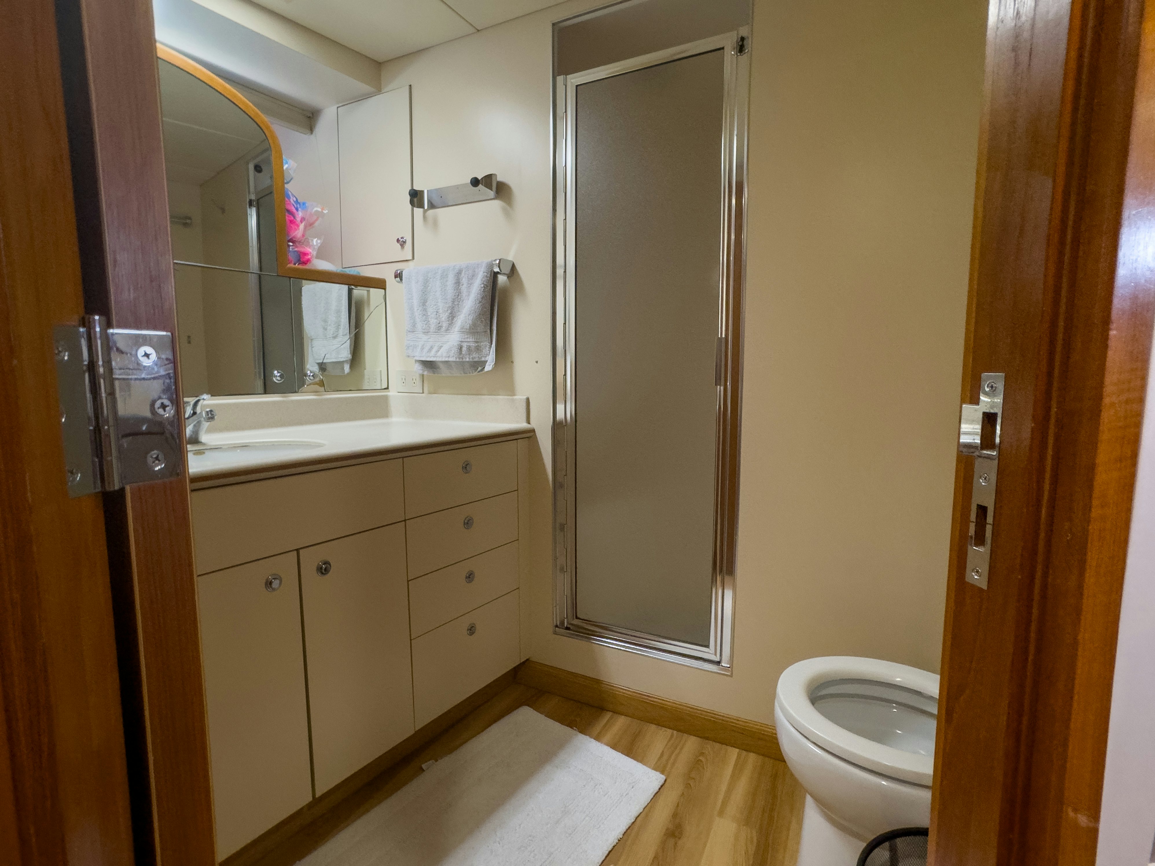 a bathroom with a toilet and a sink aboard GALE WINDS Yacht for Sale