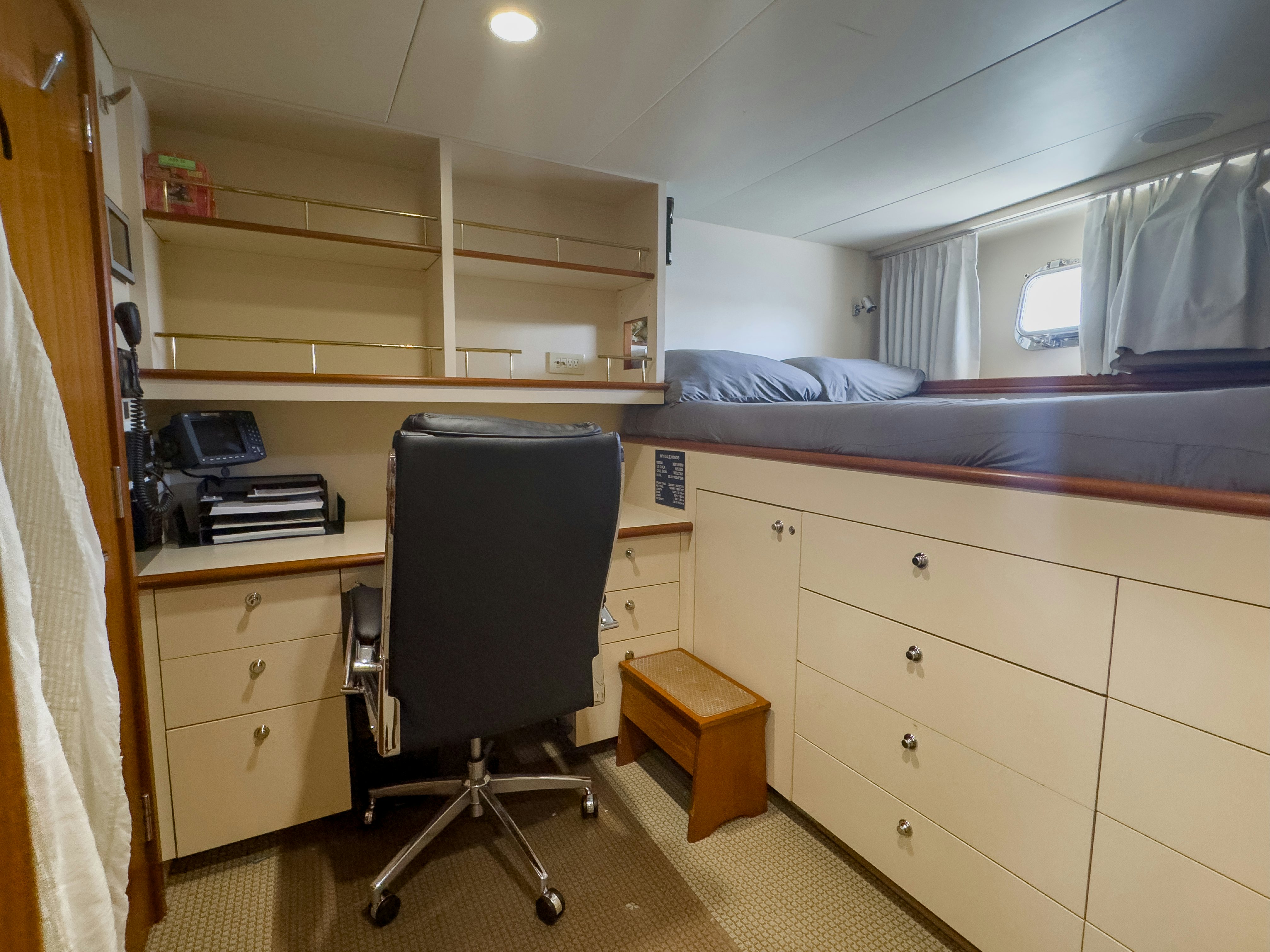 a room with a desk and a bed aboard GALE WINDS Yacht for Sale