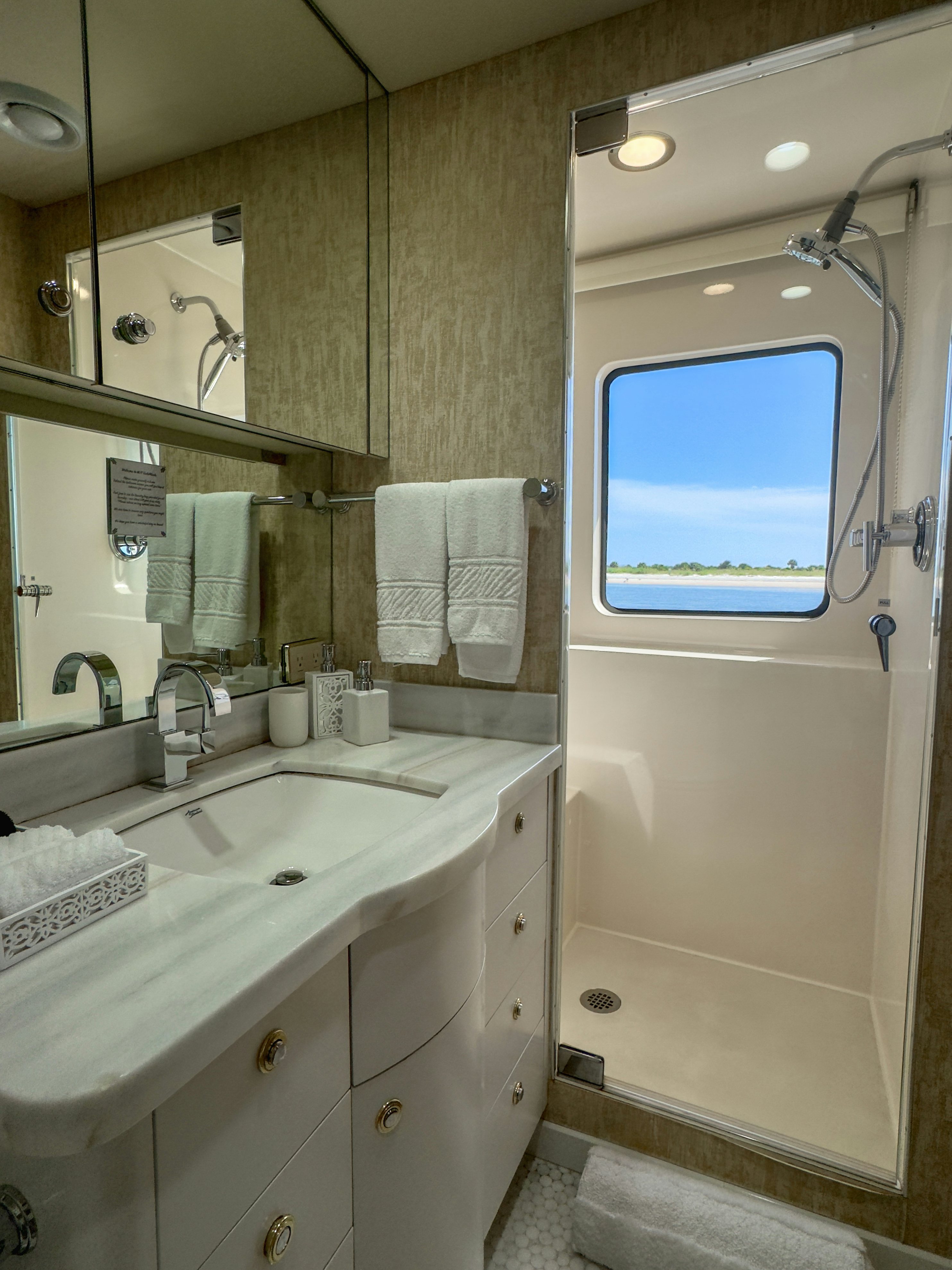 a bathroom with a shower and sink aboard GALE WINDS Yacht for Sale