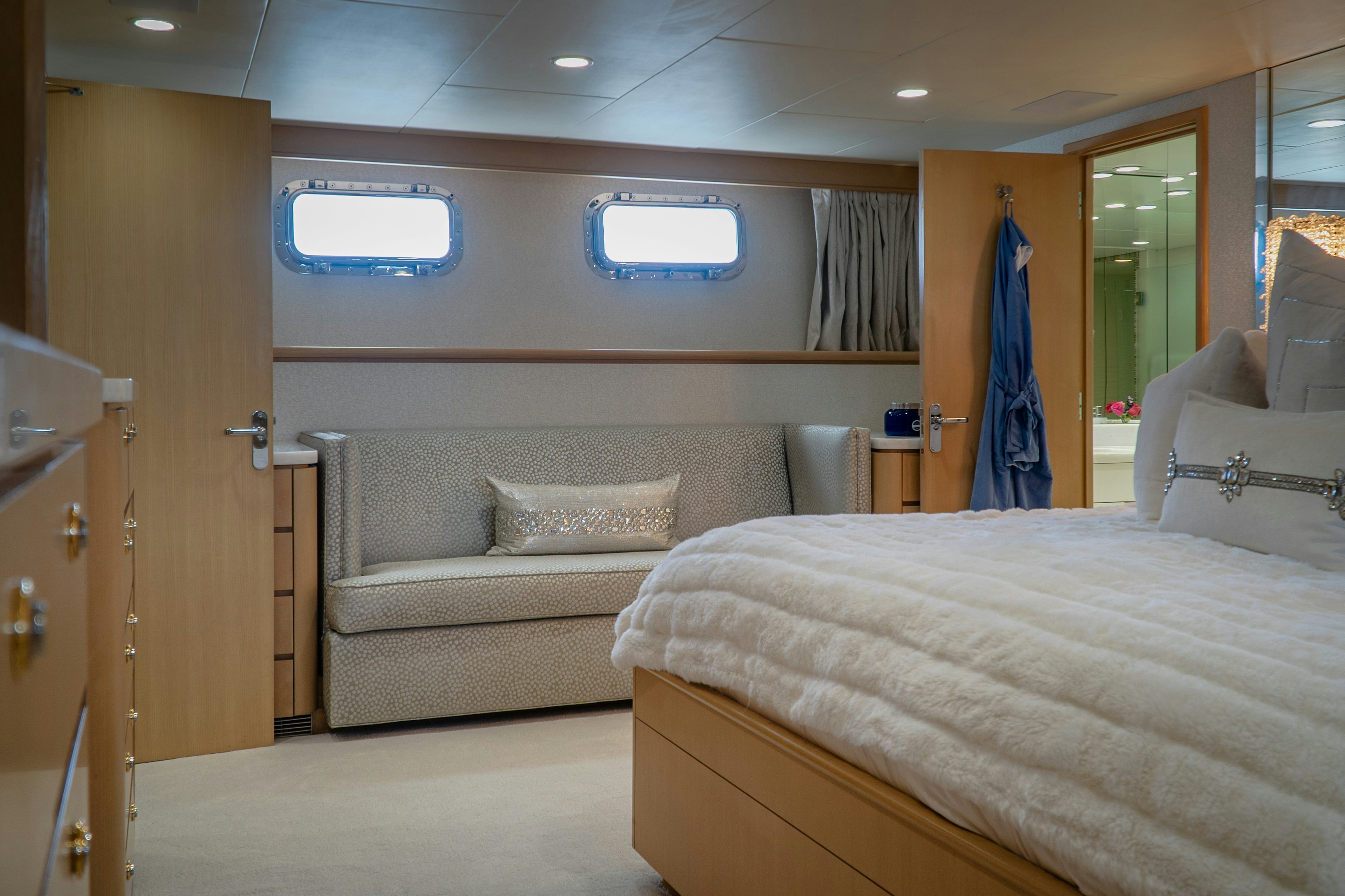 a bedroom with a bed and a couch aboard GALE WINDS Yacht for Sale