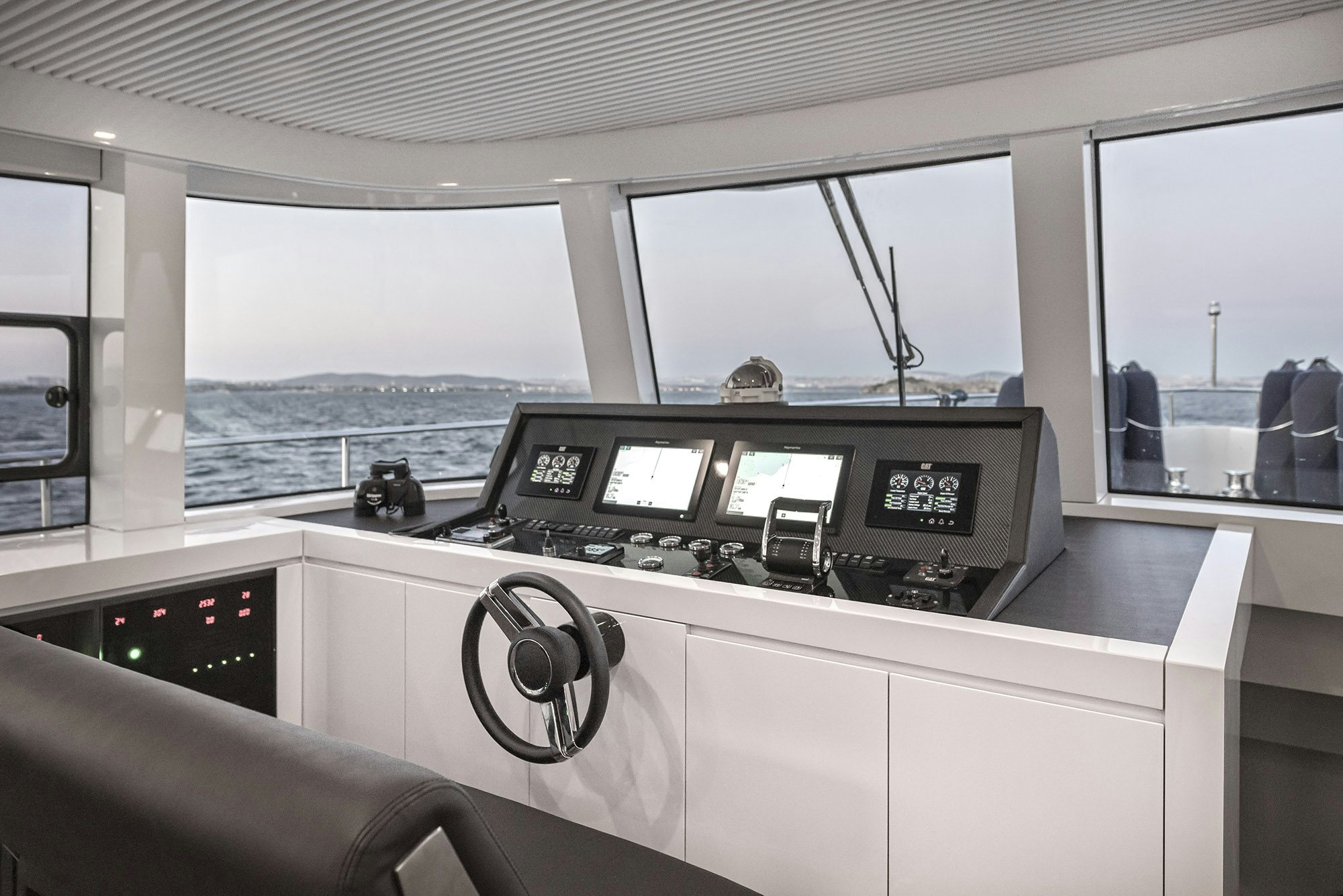 a black and white photo of a car on a road aboard IGUAZU Yacht for Sale