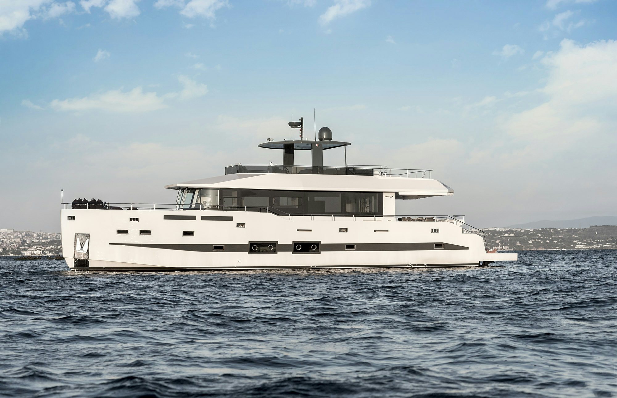 a large white boat in the water aboard IGUAZU Yacht for Sale