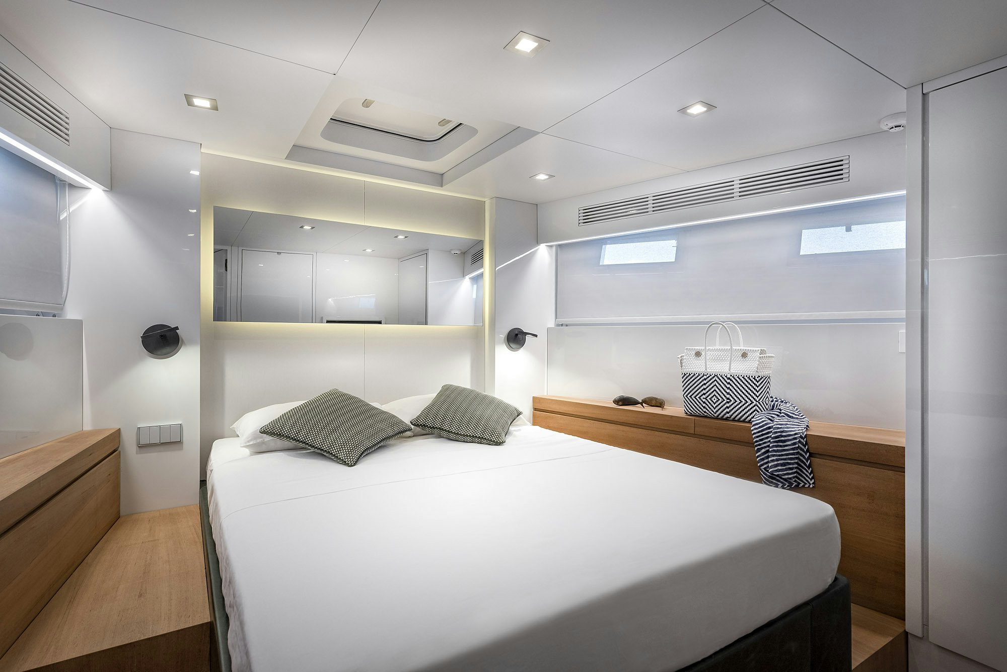a room with a bed and a desk aboard IGUAZU Yacht for Sale
